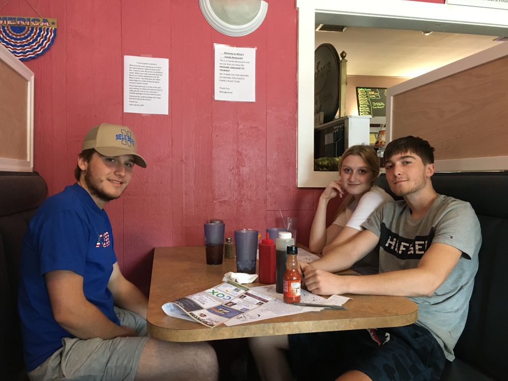 Jake, 18, (right), and Tyler, 20, (left), who have not been vaccinated against COVID-19, at Missy's Family Restaurant in Woonsocket, R.I.
