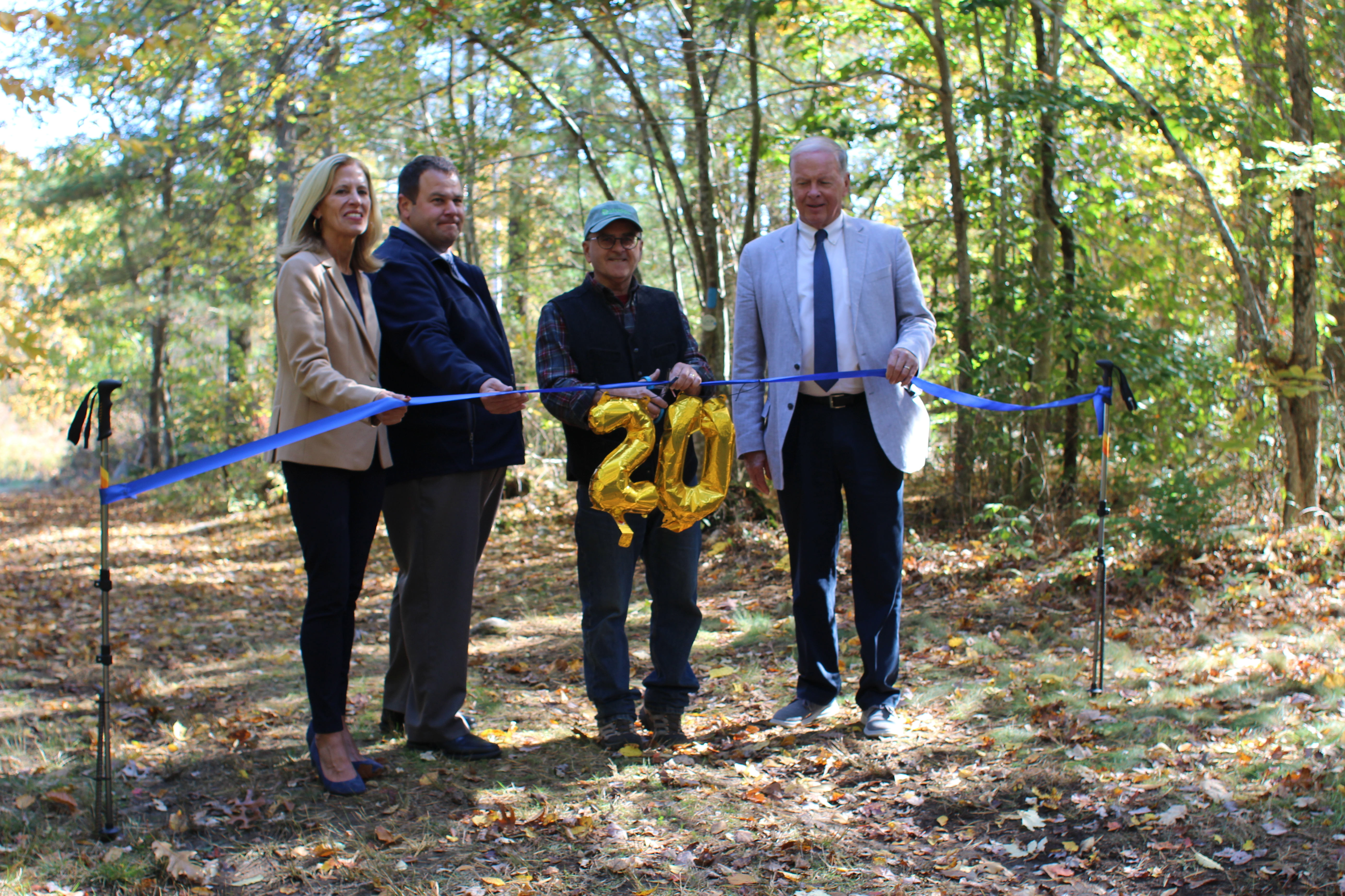 State Rep. Carol Fiola, Community Utilities director Paul Ferland, Forester Mike Labossiere and Mayor Paul Coogan cut the ribbon for the new trail.