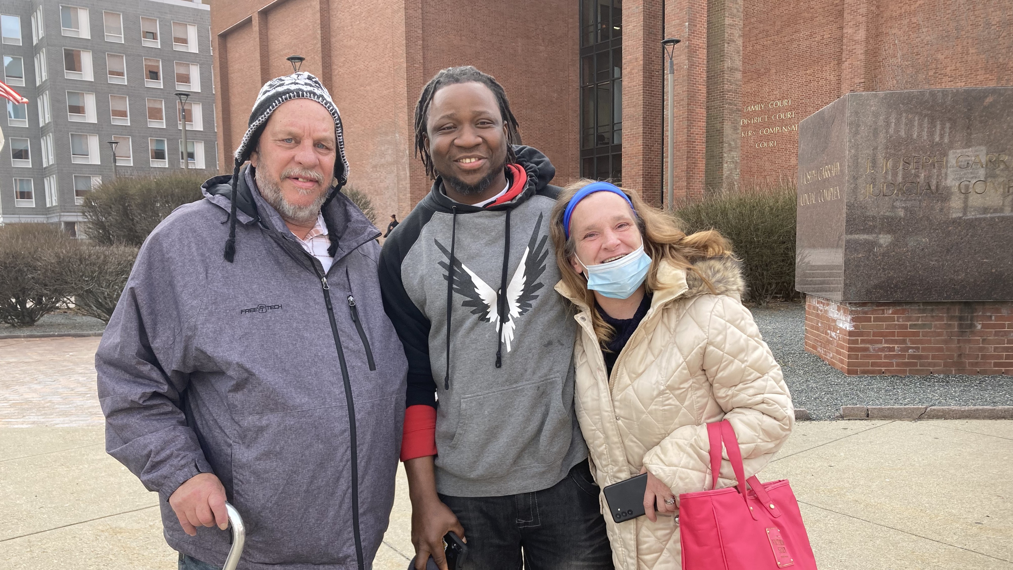 Mack Blackie (center) with William Grover and his wife, Veronica Higbie, outside the Garrahy Judicial Complex, Providence, R.I., in February 2023. The couple helped to exonerate Blackie.