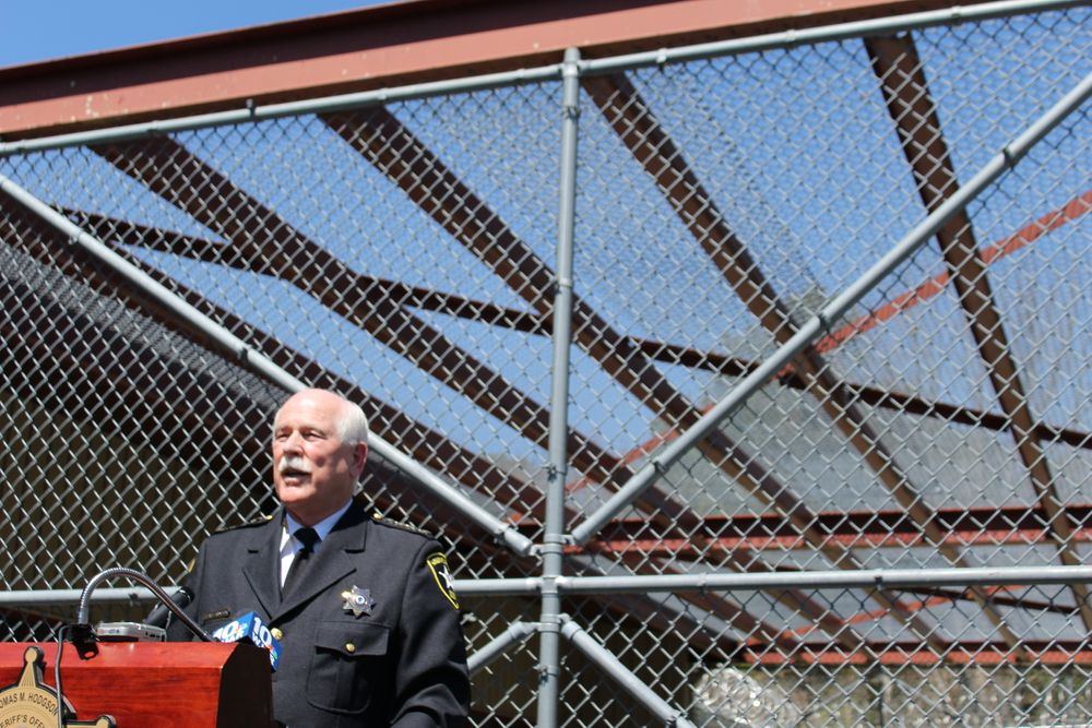 Sheriff Thomas Hodgson speaks at a press conference where he opened the battered ICE detention center to visitors.