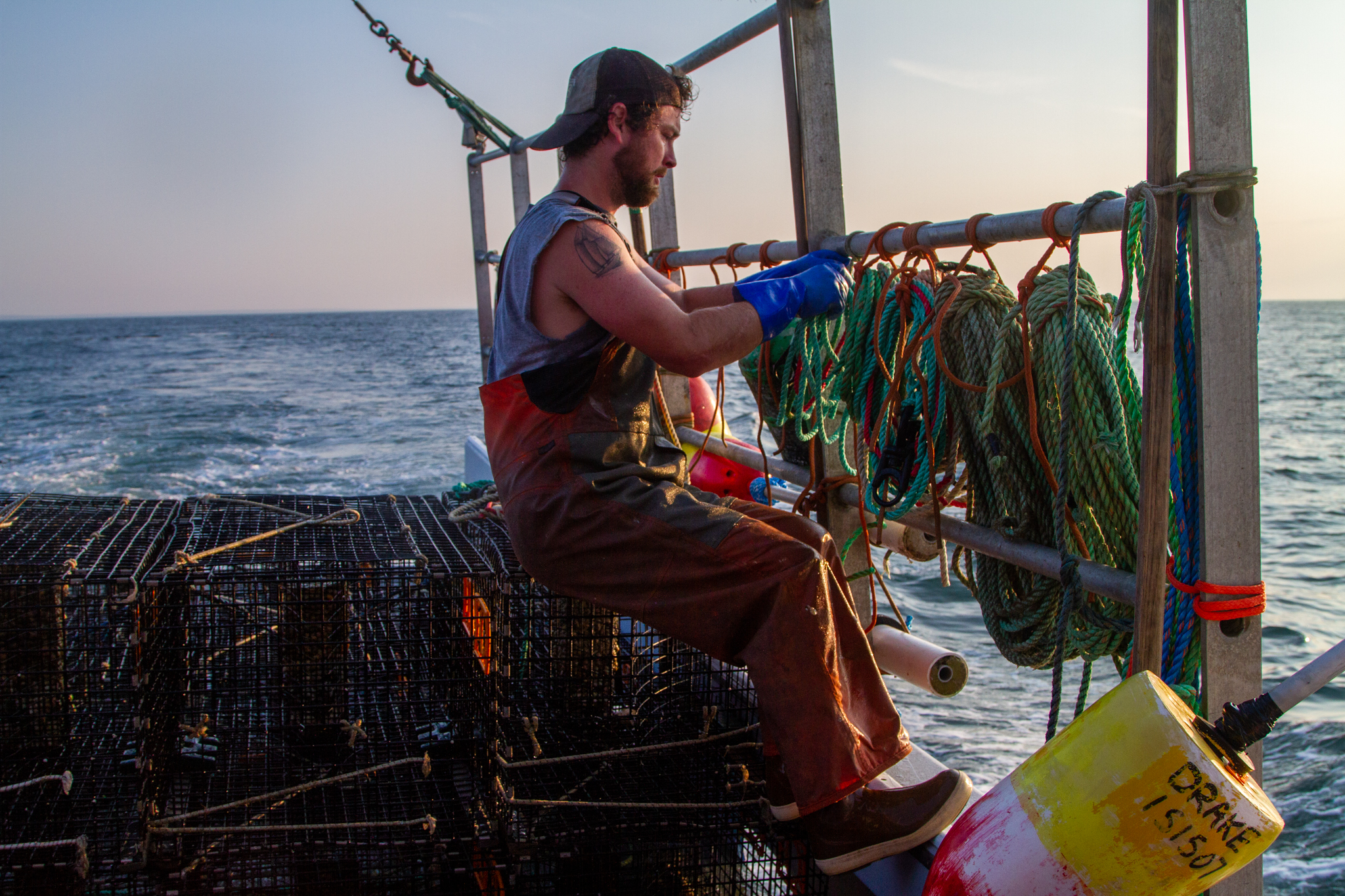 Pictured: Fisherman Rob Sherman of Providence prepares fish traps.