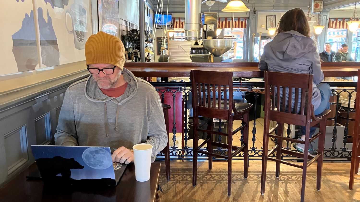 Jeffrey Marcus enjoys a coffee as he writes early in the morning at Custom House Coffee in Middletown, on Thursday, March 20, 2023. 