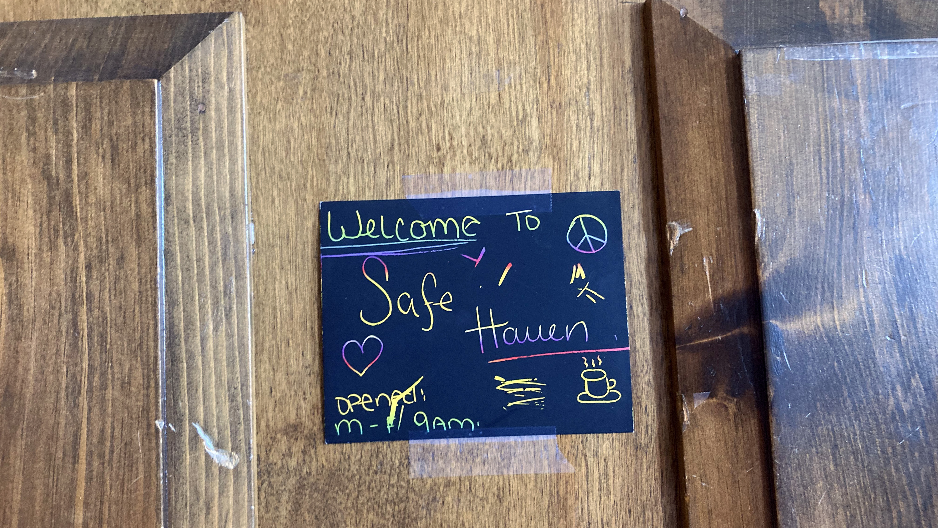 A sign taped to the door of Safe Haven, a drop-in center for homeless people in Woonsocket, RI