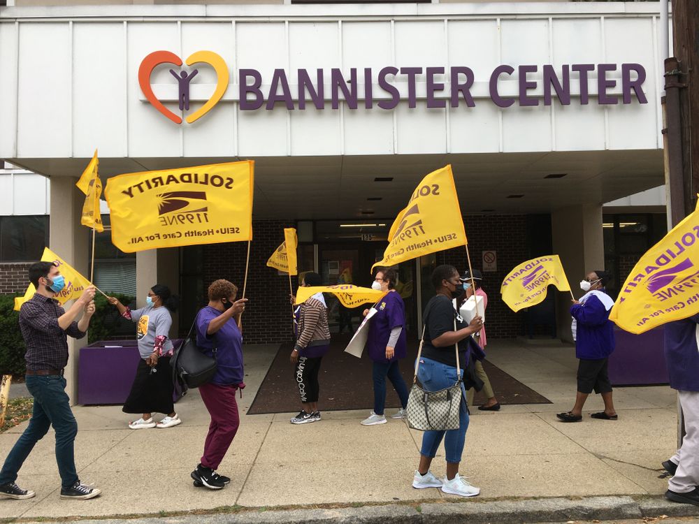 Striking workers picket outside the Bannister Center for Rehabilitation and Nursing in Providence.