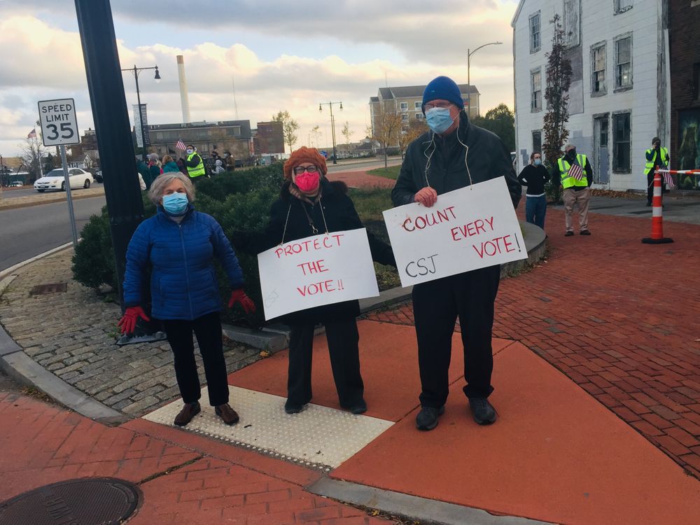 Protesters in New Bedford calling on officials to protect and count all votes. 
