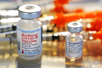 Moderna and Pfizer vials of COVID-19 vaccine