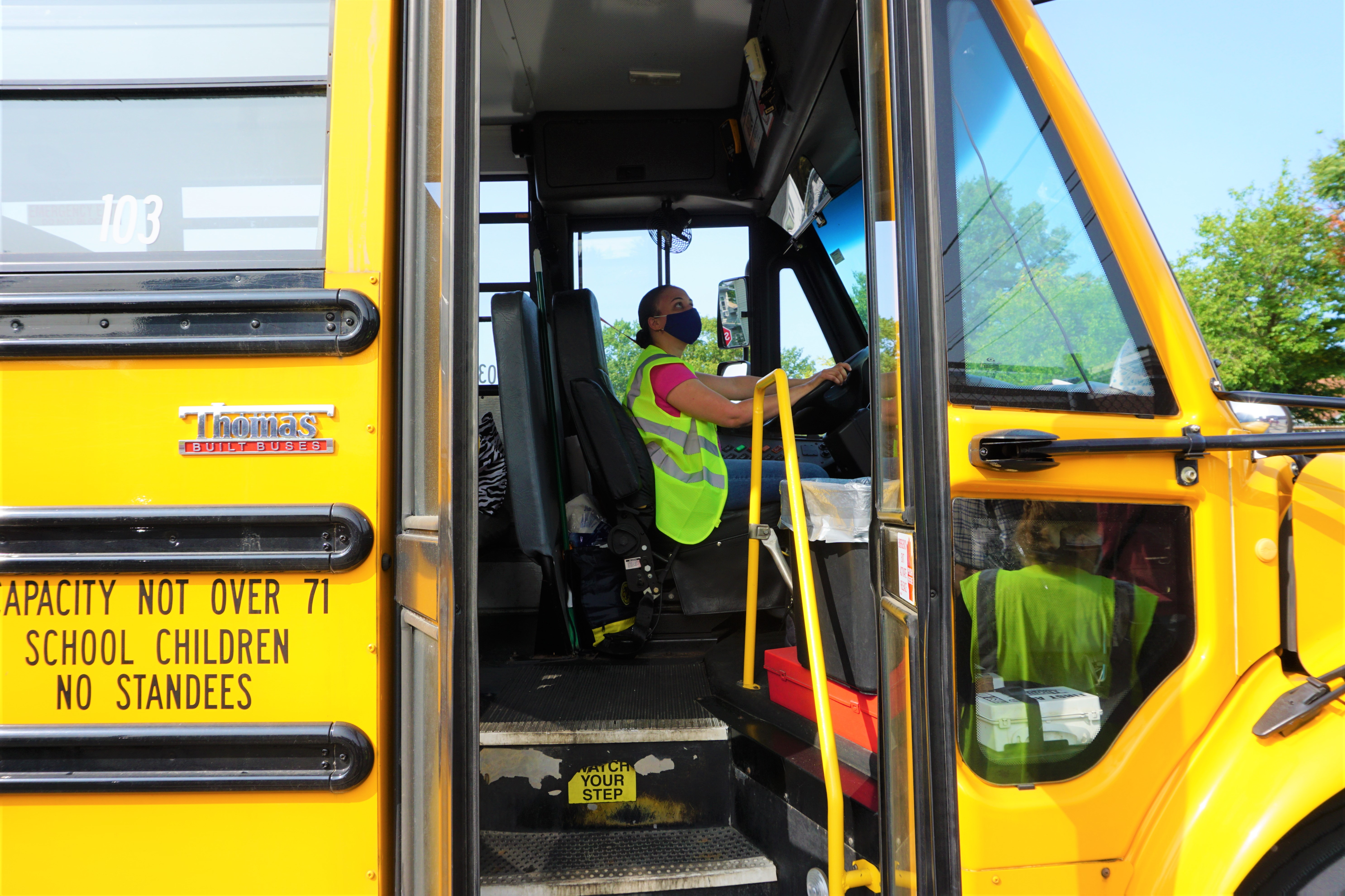 A bus driver waits for students outside Spaziano Elementary School on the first day of class.