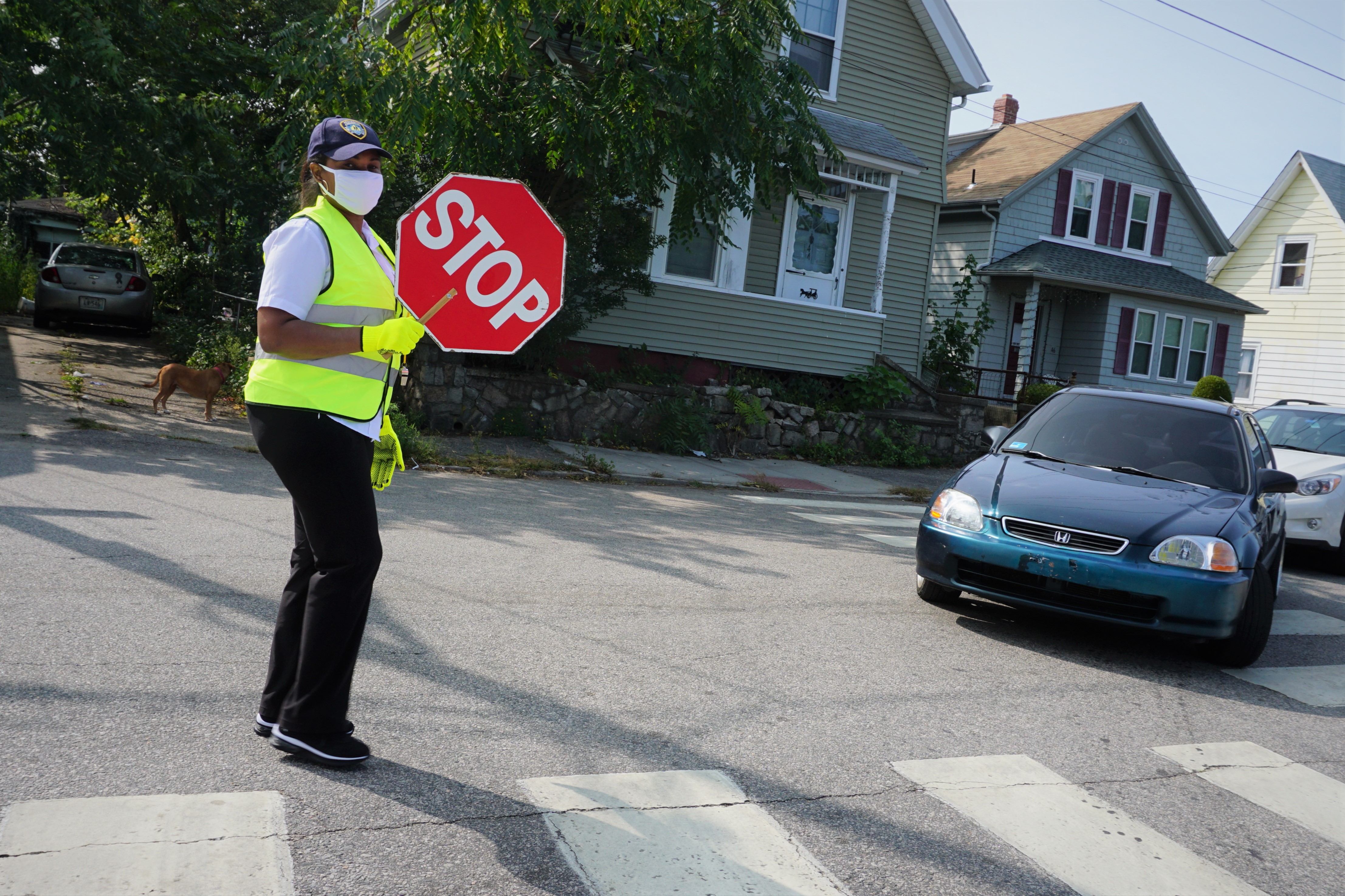 A crossing guard outside Spaziano Elementary School in Providence.