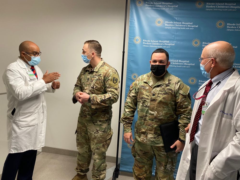From left: R.I. Hospital Chief Medical Officer Dr. Dean Roye; Army Captain Nicholas Law, Lt. Col. Edgardo Ramirez, Officer in Charge; R.I. Hospital President Dr. Saul Weingart.