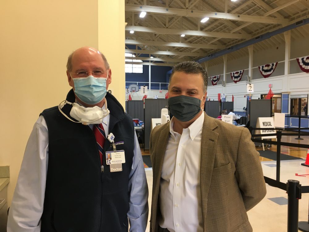 Dr. Herbert Brennan (left), the vaccination clinic's medical director, stands with East Greenwich Town Manager Andy Nota. 