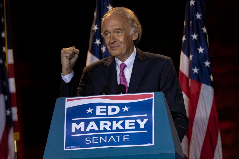 Sen. Ed Markey raises a fist in celebration after turning aside a strong primary challenge from U.S. Rep. Joseph Kennedy III. 