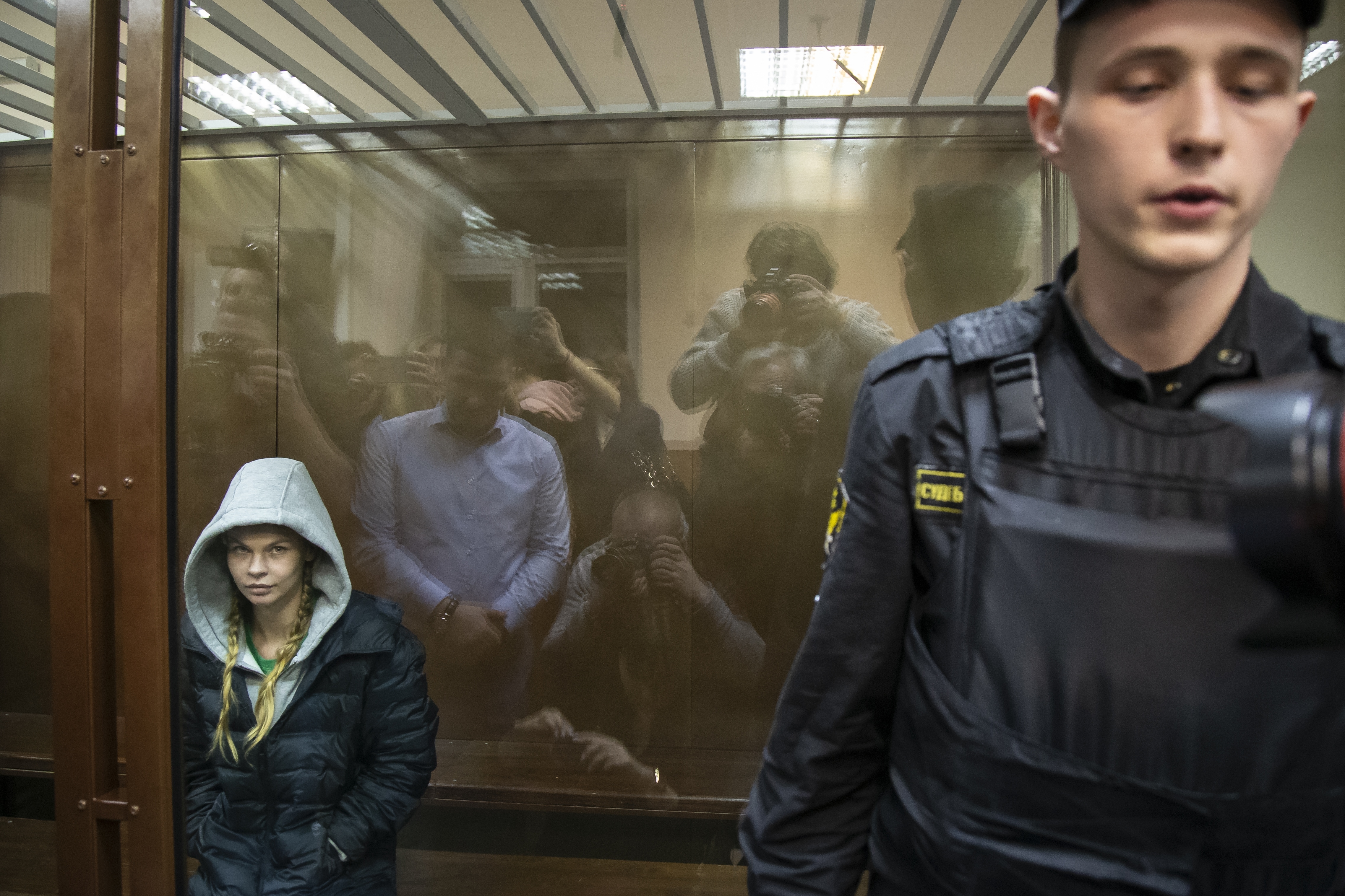 Anastasia Vashukevich, also known on social media as Nastya Rybka, left, sits in a cage in the court room in Moscow, Russia, Saturday, Jan. 19, 2019. A Belarusian model who claimed last year that she had evidence of Russian interference in the election of Donald Trump as U.S. president was arrested immediately upon her arrival in Moscow on Thursday following deportation from Thailand. (AP Photo/Alexander Zemlianichenko) Anastasia Vashukevich, also known on social media as Nastya Rybka, left, sits in a cage in the court room in Moscow, Russia, Saturday, Jan. 19, 2019. A Belarusian model who claimed last year that she had evidence of Russian interference in the election of Donald Trump as U.S. president was arrested immediately upon her arrival in Moscow on Thursday following deportation from Thailand. (AP Photo/Alexander Zemlianichenko)