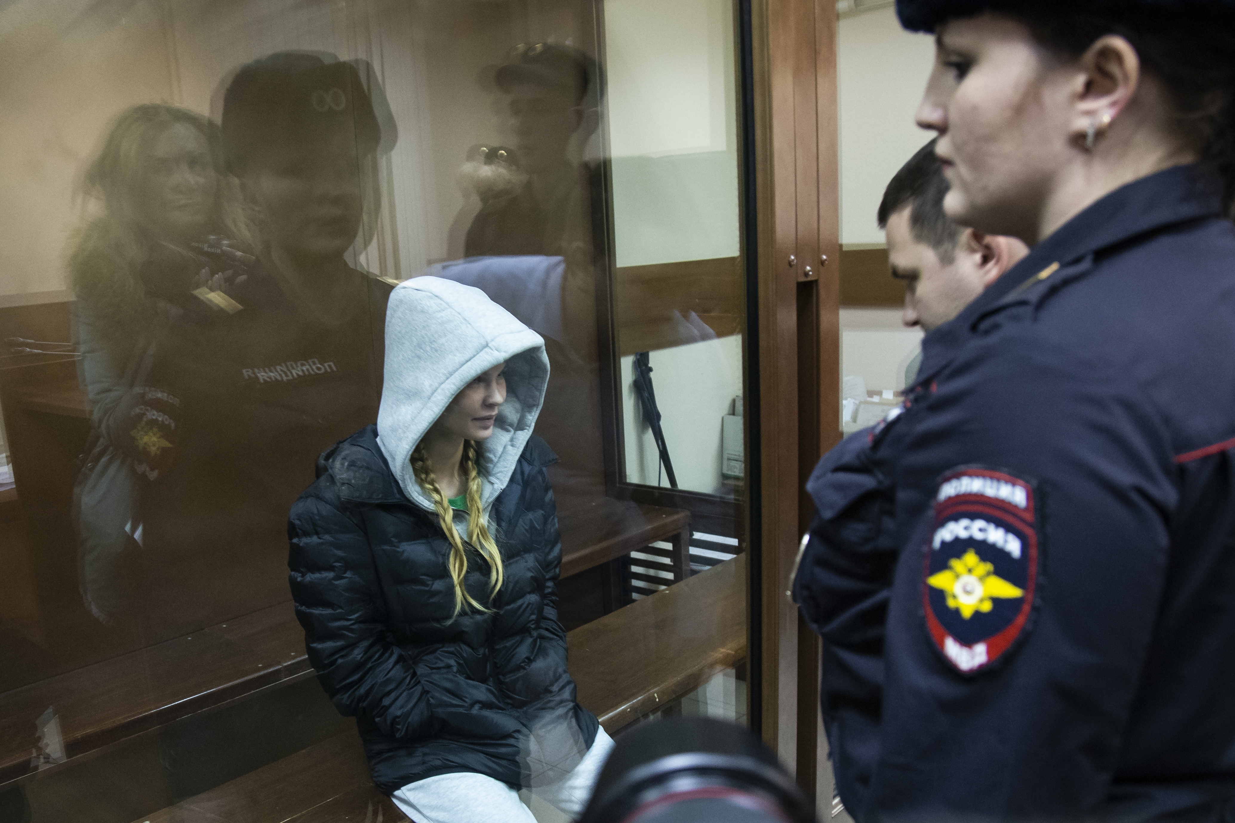 Anastasia Vashukevich, also known on social media as Nastya Rybka, left, sits in a cage in the court room in Moscow, Russia, Saturday, Jan. 19, 2019. A Belarusian model who claimed last year that she had evidence of Russian interference in the election of Donald Trump as U.S. president was arrested immediately upon her arrival in Moscow on Thursday following deportation from Thailand. (AP Photo/Alexander Zemlianichenko) Anastasia Vashukevich, also known on social media as Nastya Rybka, left, sits in a cage in the court room in Moscow, Russia, Saturday, Jan. 19, 2019. A Belarusian model who claimed last year that she had evidence of Russian interference in the election of Donald Trump as U.S. president was arrested immediately upon her arrival in Moscow on Thursday following deportation from Thailand. (AP Photo/Alexander Zemlianichenko)