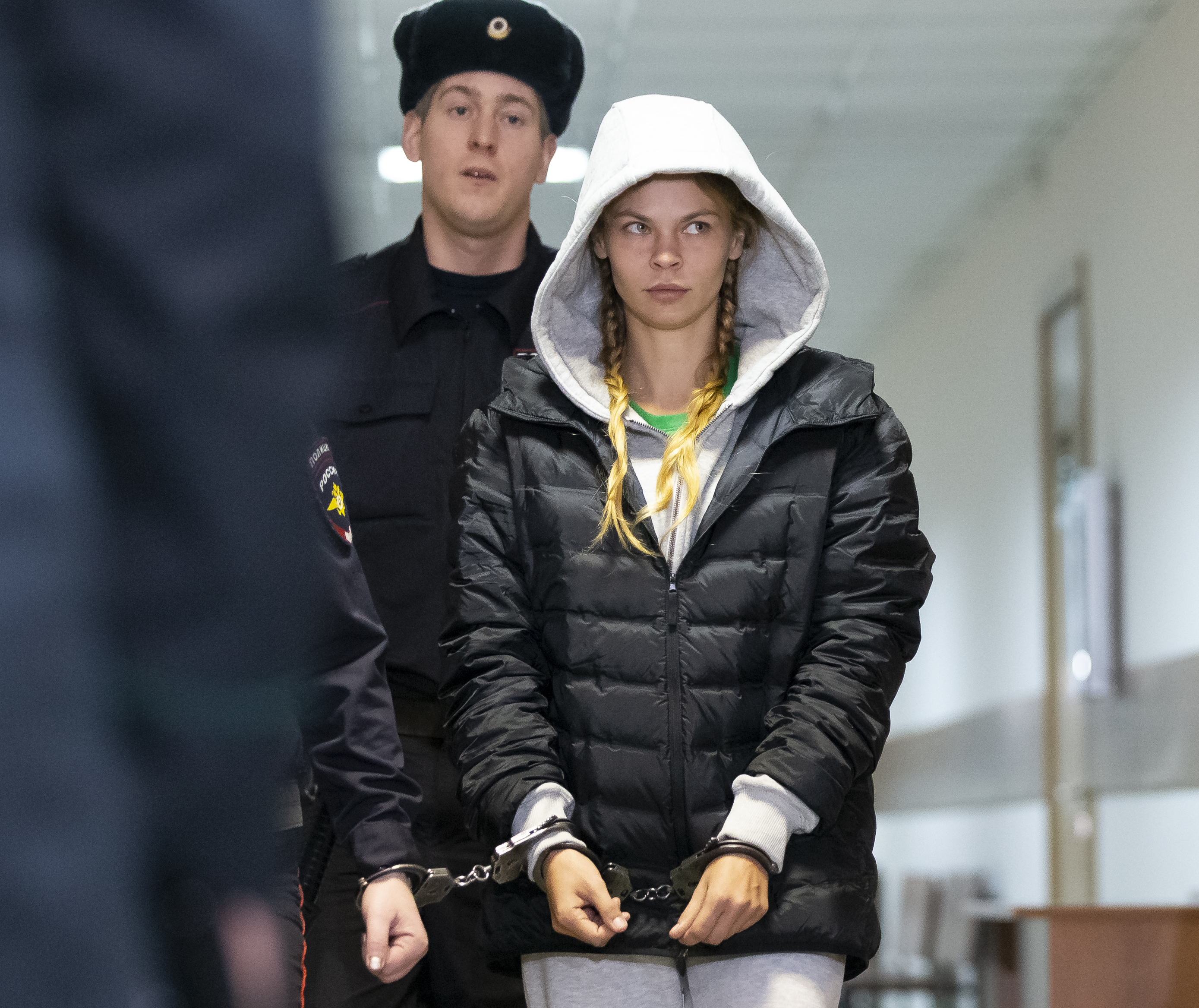 Anastasia Vashukevich, also known on social media as Nastya Rybka is escorted in the court room in Moscow, Russia, Saturday, Jan. 19, 2019. The Belarusian model Vashukevich, who claimed last year that she had evidence of Russian interference in the election of Donald Trump as U.S. president, was arrested upon arrival in Moscow on Thursday following deportation from Thailand. (AP Photo/Alexander Zemlianichenko) Anastasia Vashukevich, also known on social media as Nastya Rybka is escorted in the court room in Moscow, Russia, Saturday, Jan. 19, 2019. The Belarusian model Vashukevich, who claimed last year that she had evidence of Russian interference in the election of Donald Trump as U.S. president, was arrested upon arrival in Moscow on Thursday following deportation from Thailand. (AP Photo/Alexander Zemlianichenko)