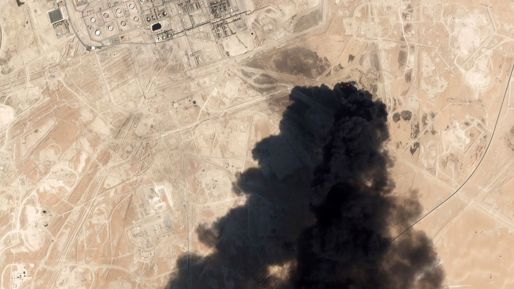 FILE - This Saturday, Sept. 14, 2019, satellite image from Planet Labs Inc., shows thick black smoke rising from Saudi Aramco's Abqaiq oil processing facility in Buqyaq, Saudi Arabia.The weekend drone attack on one of the world’s largest crude oil processing plants that dramatically cut into global oil supplies is the most visible sign yet of how Aramco’s stability and security is directly linked to that of its owner -- the Saudi government and its ruling family. (Planet Labs Inc via AP, File) FILE - This Saturday, Sept. 14, 2019, satellite image from Planet Labs Inc., shows thick black smoke rising from Saudi Aramco's Abqaiq oil processing facility in Buqyaq, Saudi Arabia.The weekend drone attack on one of the world’s largest crude oil processing plants that dramatically cut into global oil supplies is the most visible sign yet of how Aramco’s stability and security is directly linked to that of its owner -- the Saudi government and its ruling family. (Planet Labs Inc via AP, File)