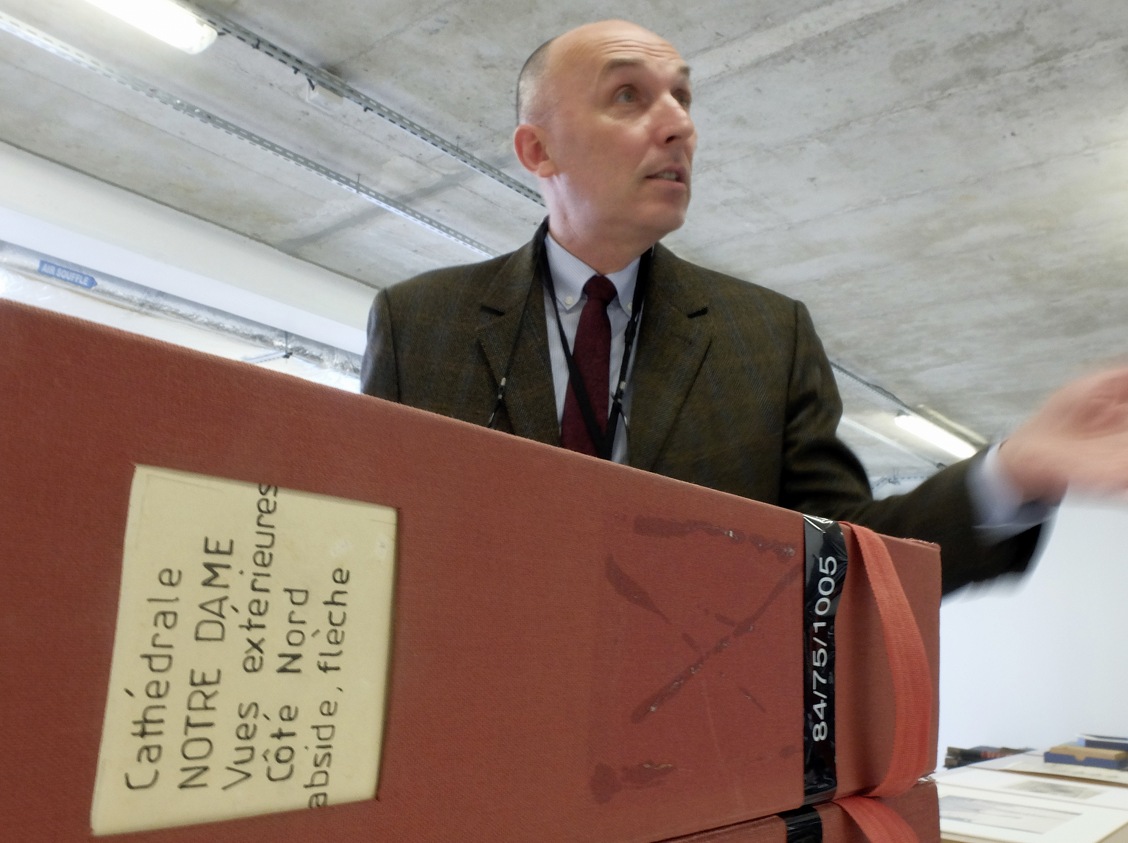 Jean-Charles Forgeret poses with files related to Notre Dame cathedral in Charenton le Pont, outside Paris, Thursday, April 18, 2019. The reconstruction of Paris' Notre Dame Cathedral will rely on part on extensive plans drawn up in the 19th century for its last big renovation. Forgeret noted that the last restoration took 20 years, and cast doubt on the French president's 5-year deadline on fixing Notre Dame this time. (AP Photo/Nicolas Garriga) Jean-Charles Forgeret poses with files related to Notre Dame cathedral in Charenton le Pont, outside Paris, Thursday, April 18, 2019. The reconstruction of Paris' Notre Dame Cathedral will rely on part on extensive plans drawn up in the 19th century for its last big renovation. Forgeret noted that the last restoration took 20 years, and cast doubt on the French president's 5-year deadline on fixing Notre Dame this time. (AP Photo/Nicolas Garriga)