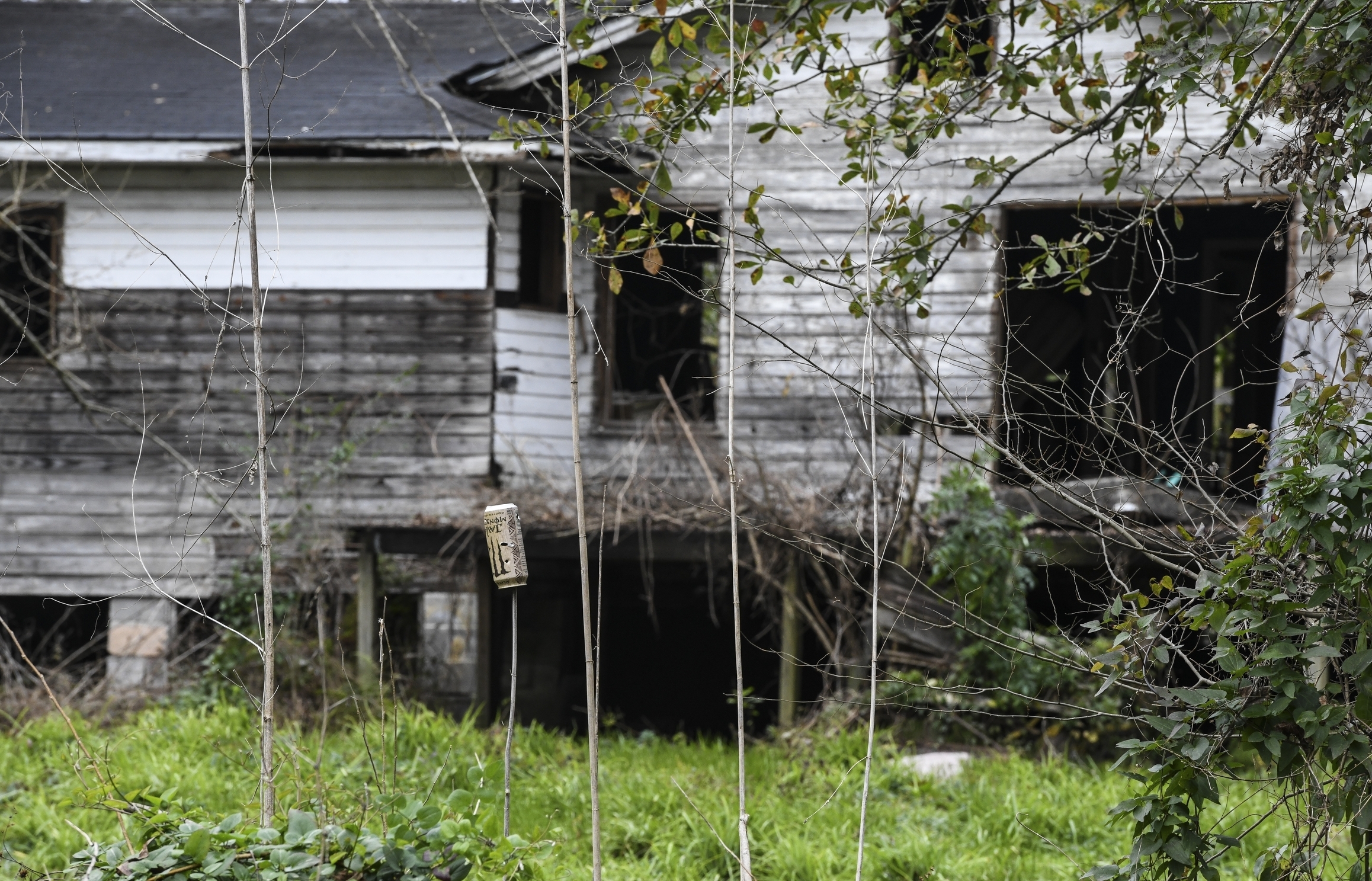 A dilapidated home can be seen from neighboring Old Plateau Cemetery, the final resting place for many who spent their lives in Africatown, near Mobile, Ala., on Tuesday, Jan. 29, 2019. Many of the survivors of the Clotilda's voyage are buried here amongst the trees. (AP Photo/Julie Bennett) A dilapidated home can be seen from neighboring Old Plateau Cemetery, the final resting place for many who spent their lives in Africatown, near Mobile, Ala., on Tuesday, Jan. 29, 2019. Many of the survivors of the Clotilda's voyage are buried here amongst the trees. (AP Photo/Julie Bennett)
