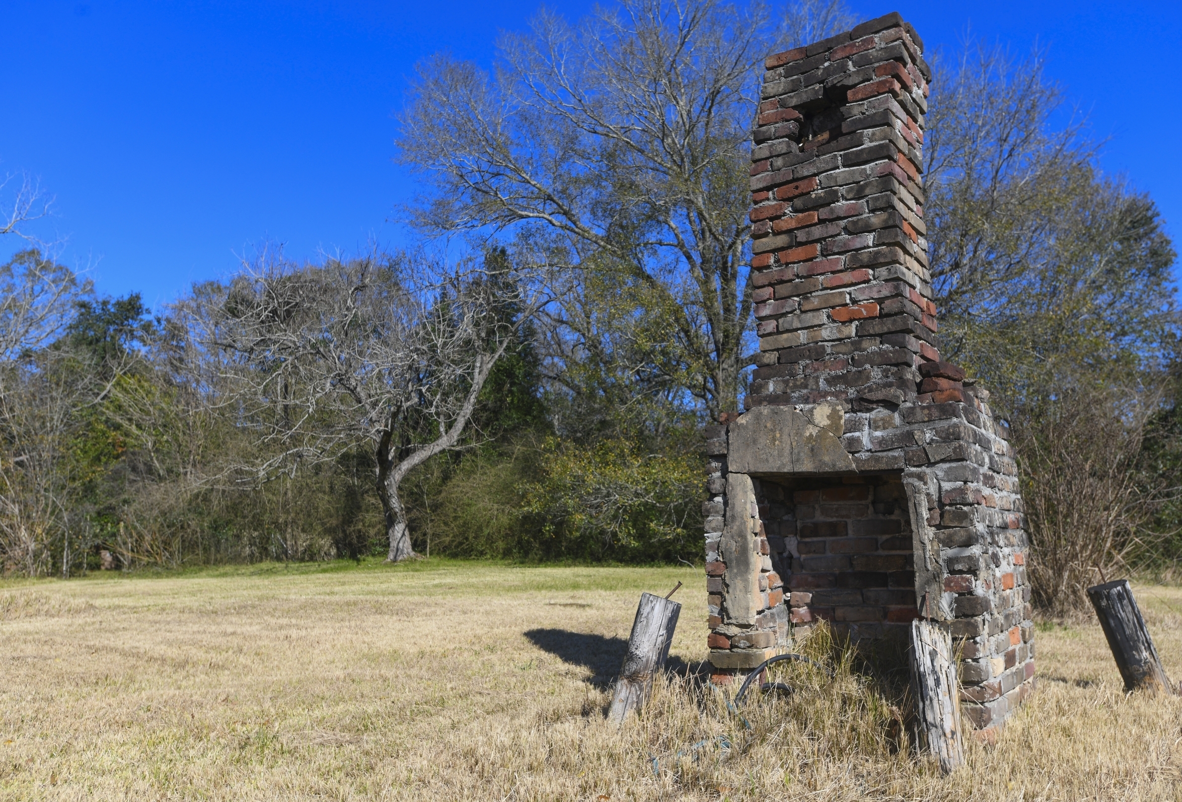 A chimney, the last remaining original structure from the days when survivors of the Clotilda, the last known slave ship brought into the United States, inhabited the area, stands in an abandoned lot in Africatown in Mobile, Ala., on Tuesday, Jan. 29, 2019. After years of watching the steady decline, descendants of the freed slaves who established Africatown are trying to create new ties and, perhaps, rebuild a community that’s in danger of fading away. (AP Photo/Julie Bennett) A chimney, the last remaining original structure from the days when survivors of the Clotilda, the last known slave ship brought into the United States, inhabited the area, stands in an abandoned lot in Africatown in Mobile, Ala., on Tuesday, Jan. 29, 2019. After years of watching the steady decline, descendants of the freed slaves who established Africatown are trying to create new ties and, perhaps, rebuild a community that’s in danger of fading away. (AP Photo/Julie Bennett)