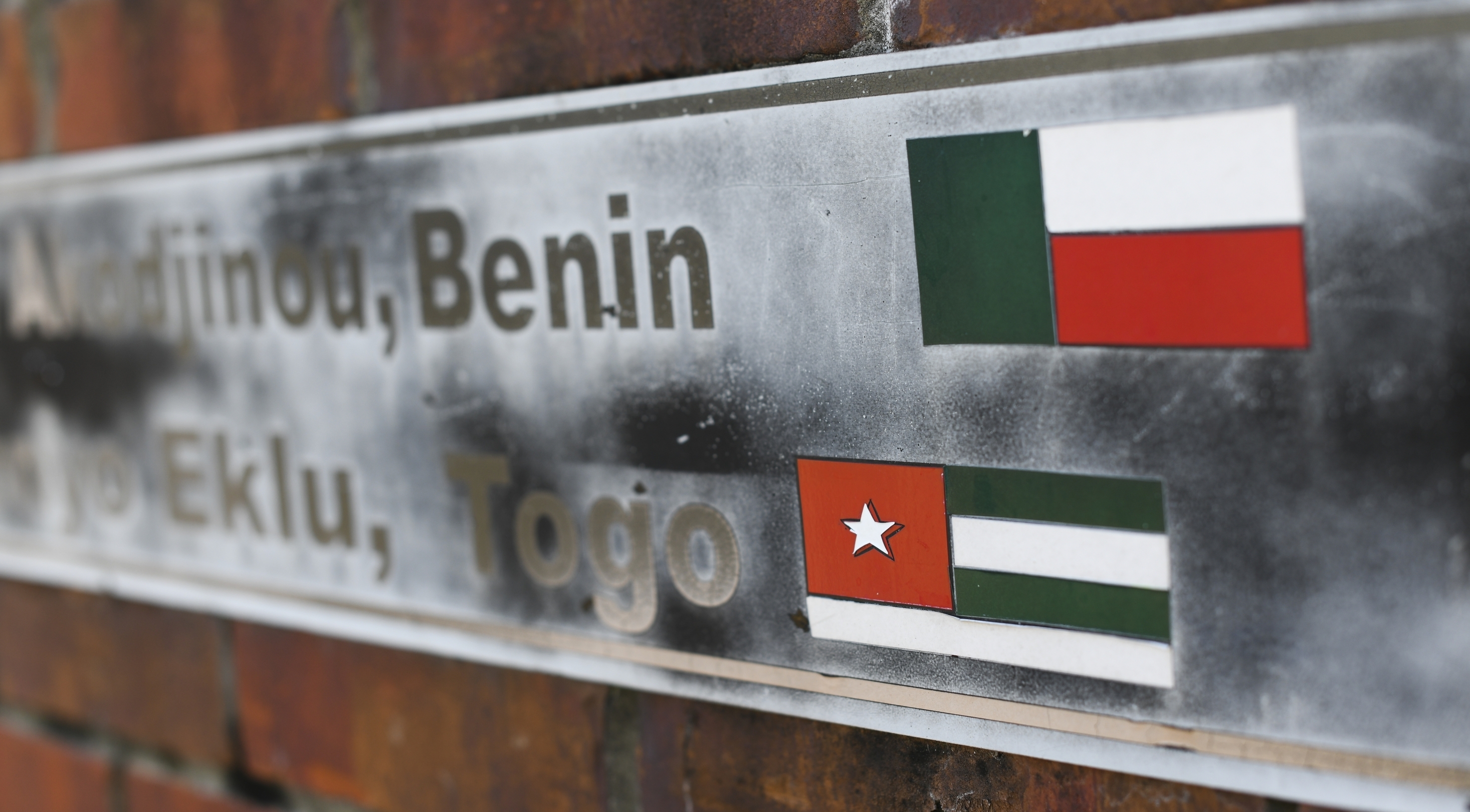 The flags of the nations of Benin and Togo, the west African homes of the survivors of the Clotilda, remain on display on a monument at what was the Africatown Welcome Center in Mobile, Ala., on Tuesday, Jan. 29, 2019. The center was destroyed by Hurricane Katrina in 2005, and hasn't been rebuilt. (AP Photo/Julie Bennett) The flags of the nations of Benin and Togo, the west African homes of the survivors of the Clotilda, remain on display on a monument at what was the Africatown Welcome Center in Mobile, Ala., on Tuesday, Jan. 29, 2019. The center was destroyed by Hurricane Katrina in 2005, and hasn't been rebuilt. (AP Photo/Julie Bennett)