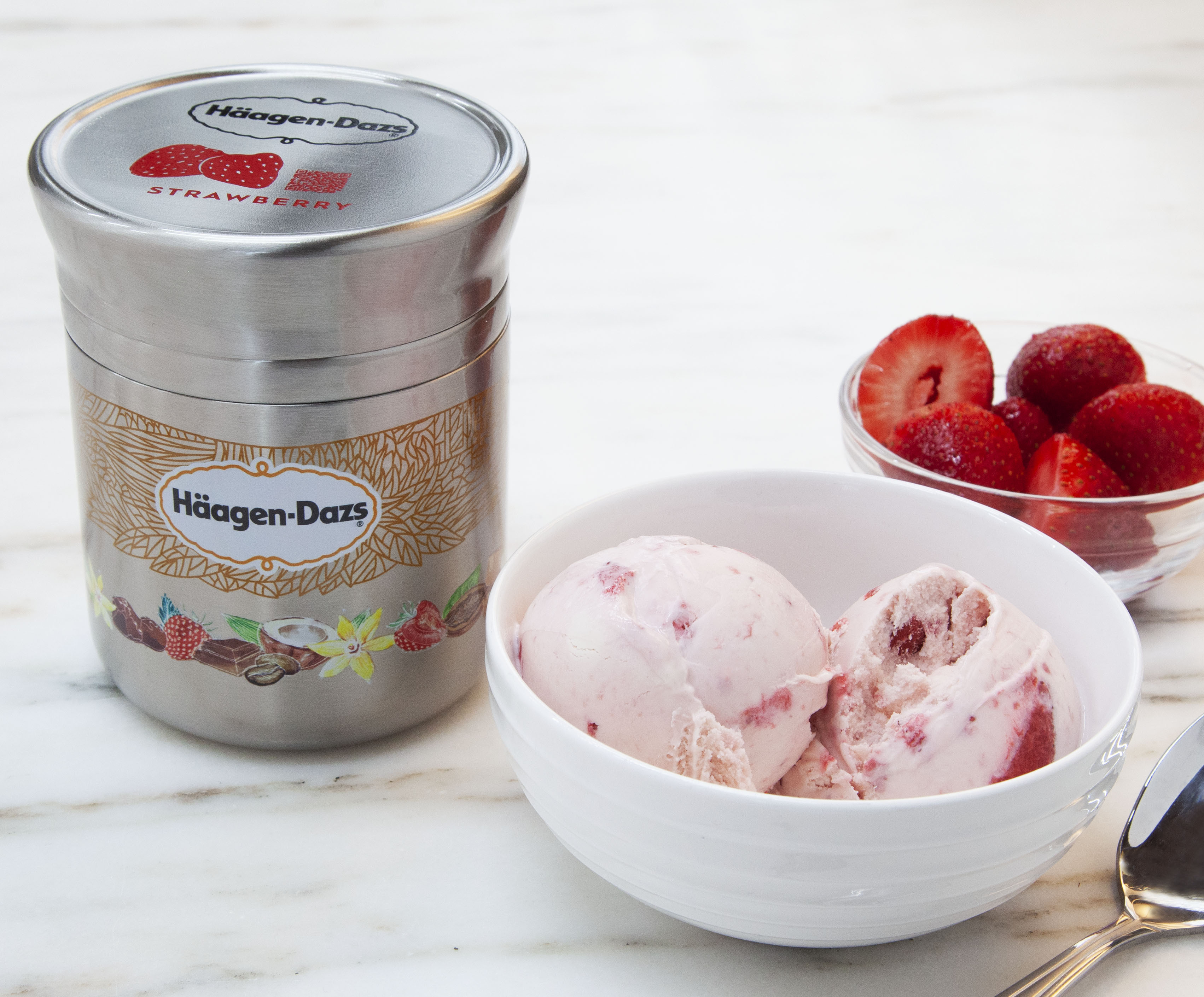 This photo shows Nestle's stainless steel Häagan-Dazs ice cream container designed for use with Loop. The new shopping platform announced at the World Economic Forum aims to change the way people buy many products, from food to personal-care and home products. Loop would do away with disposable containers for some name-brand products, including some shampoos and laundry detergents. Instead, those products would be delivered in sleek, reusable containers that will be picked up at your door, washed and refilled. (Chris Crane/TerraCycle via AP) This photo shows Nestle's stainless steel Häagan-Dazs ice cream container designed for use with Loop. The new shopping platform announced at the World Economic Forum aims to change the way people buy many products, from food to personal-care and home products. Loop would do away with disposable containers for some name-brand products, including some shampoos and laundry detergents. Instead, those products would be delivered in sleek, reusable containers that will be picked up at your door, washed and refilled. (Chris Crane/TerraCycle via AP)