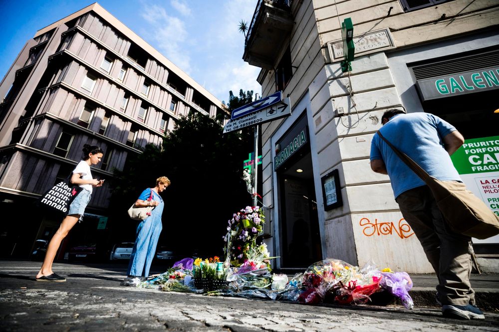 People stop by flowers and messages left on the spot, in Rome, Saturday, July 27, 2019, where Carabinieri officer Mario Cerciello Rega was stabbed to death early Friday. In a statement Saturday, Carabinieri officers investigating the death of Cerciello Rega, 35, said two young American tourists have been detained for alleged murder and attempted extortion. (Angelo Carconi/ANSA via AP) People stop by flowers and messages left on the spot, in Rome, Saturday, July 27, 2019, where Carabinieri officer Mario Cerciello Rega was stabbed to death early Friday. In a statement Saturday, Carabinieri officers investigating the death of Cerciello Rega, 35, said two young American tourists have been detained for alleged murder and attempted extortion. (Angelo Carconi/ANSA via AP)