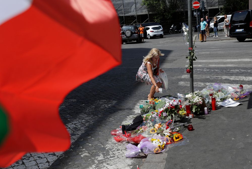 A woman leaves a note in memory on the spot where Mario Cerciello Rega was stabbed to death, in Rome, Saturday, July 27, 2019. In a statement Saturday, Carabinieri officers investigating the death Friday of officer Cerciello Rega, 35, said two American turists, both 19, have been detained for alleged murder and attempted extortion. (AP Photo/Andrew Medichini) A woman leaves a note in memory on the spot where Mario Cerciello Rega was stabbed to death, in Rome, Saturday, July 27, 2019. In a statement Saturday, Carabinieri officers investigating the death Friday of officer Cerciello Rega, 35, said two American turists, both 19, have been detained for alleged murder and attempted extortion. (AP Photo/Andrew Medichini)