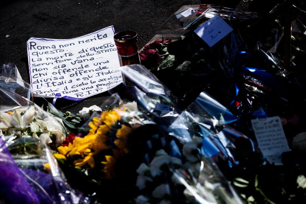 Flowers and messages are left on the spot, in Rome, Saturday, July 27, 2019, where Carabinieri officer Mario Cerciello Rega was stabbed to death early Friday. In a statement Saturday, Carabinieri officers investigating the death of Cerciello Rega, 35, said two young American tourists have been detained for alleged murder and attempted extortion. Ticket at left reads in Italian: Flowers and messages are left on the spot, in Rome, Saturday, July 27, 2019, where Carabinieri officer Mario Cerciello Rega was stabbed to death early Friday. In a statement Saturday, Carabinieri officers investigating the death of Cerciello Rega, 35, said two young American tourists have been detained for alleged murder and attempted extortion. Ticket at left reads in Italian: