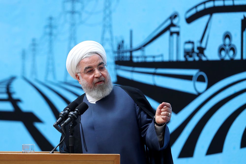 In this photo released by the official website of the office of the Iranian Presidency, President Hassan Rouhani speaks in a conference in Tehran, Iran, Monday, Aug. 26, 2019. Rouhani defended his foreign minister's surprise visit to the G-7 summit, saying he ready to go anywhere to negotiate a way out of the crisis following the U.S. pullout from the nuclear deal. (Iranian Presidency Office via AP) In this photo released by the official website of the office of the Iranian Presidency, President Hassan Rouhani speaks in a conference in Tehran, Iran, Monday, Aug. 26, 2019. Rouhani defended his foreign minister's surprise visit to the G-7 summit, saying he ready to go anywhere to negotiate a way out of the crisis following the U.S. pullout from the nuclear deal. (Iranian Presidency Office via AP)