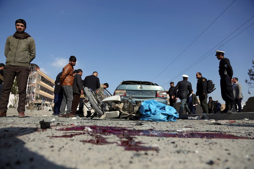 Afghan security personnel gather at the site of a car bomb attack in Kabul, Afghanistan, Wednesday, Nov. 13, 2019. A car bomb detonated in the Afghan capital of Kabul during Wednesday's morning commute, killing several people, officials said. (AP Photo/Rahmat Gul) Afghan security personnel gather at the site of a car bomb attack in Kabul, Afghanistan, Wednesday, Nov. 13, 2019. A car bomb detonated in the Afghan capital of Kabul during Wednesday's morning commute, killing several people, officials said. (AP Photo/Rahmat Gul)