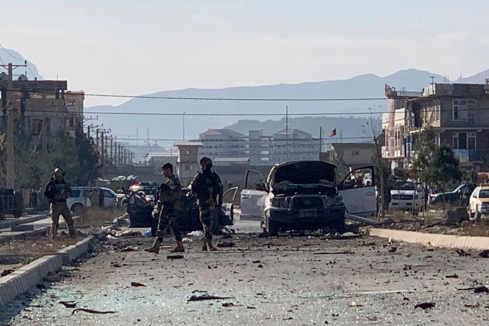 Afghan security personnel gather at the site of an explosion in Kabul, Afghanistan, Wednesday, Nov. 13, 2019. An explosion has rocked the Afghan capital of Kabul as early morning commuters were on the street heading to work. (AP Photo/Rahmat Gul) Afghan security personnel gather at the site of an explosion in Kabul, Afghanistan, Wednesday, Nov. 13, 2019. An explosion has rocked the Afghan capital of Kabul as early morning commuters were on the street heading to work. (AP Photo/Rahmat Gul)