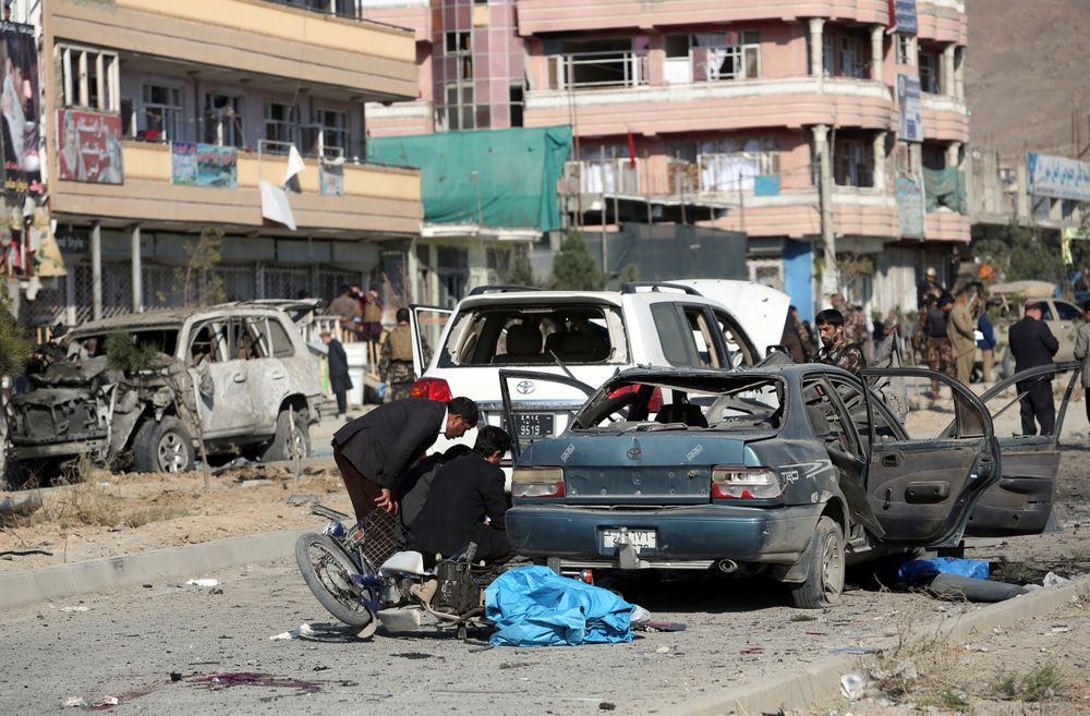 Security personnel gather at the site of car bomb attack in Kabul, Afghanistan, Wednesday, Nov. 13, 2019. A car bomb detonated in the Afghan capital during Wednesday's morning commute killing seven people and wounding at least seven, officials said. (AP Photo/Rahmat Gul) Security personnel gather at the site of car bomb attack in Kabul, Afghanistan, Wednesday, Nov. 13, 2019. A car bomb detonated in the Afghan capital during Wednesday's morning commute killing seven people and wounding at least seven, officials said. (AP Photo/Rahmat Gul)