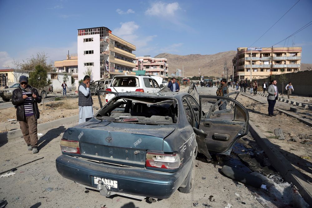Afghan security personnel gather at the site of a car bomb attack in Kabul, Afghanistan, Wednesday, Nov. 13, 2019. A car bomb detonated in the Afghan capital of Kabul during Wednesday's morning commute, killing several people, officials said. (AP Photo/Rahmat Gul) Afghan security personnel gather at the site of a car bomb attack in Kabul, Afghanistan, Wednesday, Nov. 13, 2019. A car bomb detonated in the Afghan capital of Kabul during Wednesday's morning commute, killing several people, officials said. (AP Photo/Rahmat Gul)