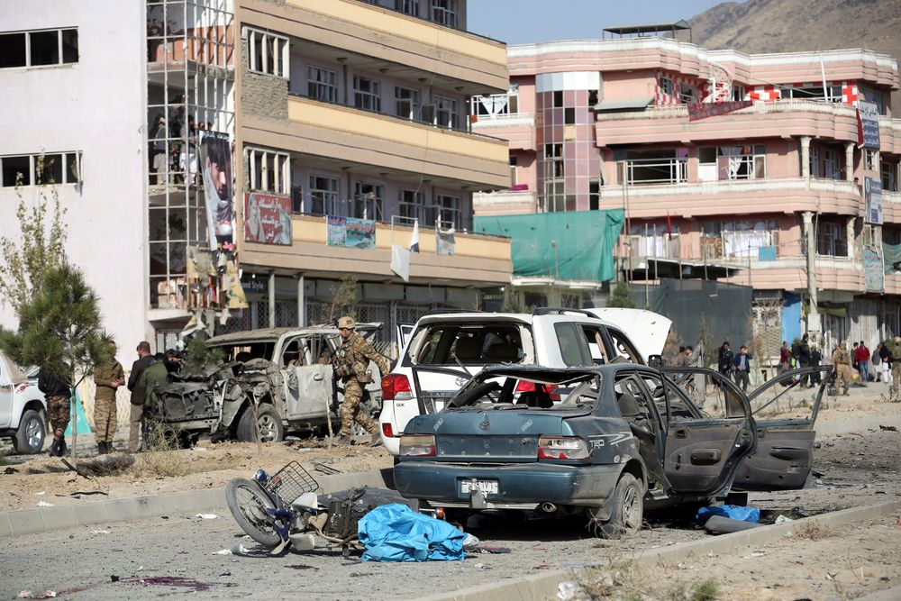 Afghan security personnel gather at the site of a car bomb attack in Kabul, Afghanistan, Wednesday, Nov. 13, 2019. A car bomb detonated in the Afghan capital of Kabul during Wednesday's morning commute, killing several people, officials said. (AP Photo/Rahmat Gul) Afghan security personnel gather at the site of a car bomb attack in Kabul, Afghanistan, Wednesday, Nov. 13, 2019. A car bomb detonated in the Afghan capital of Kabul during Wednesday's morning commute, killing several people, officials said. (AP Photo/Rahmat Gul)