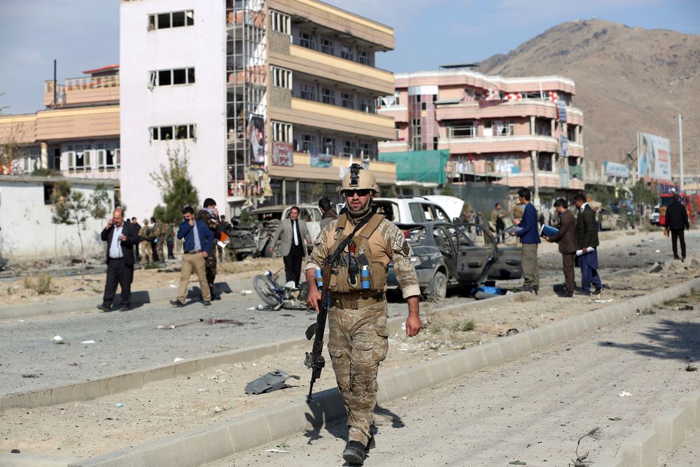 Afghan security personnel gather at the site of a car bomb attack in Kabul, Afghanistan, Wednesday, Nov. 13, 2019. A car bomb detonated in the Afghan capital of Kabul during Wednesday's morning commute, killing several people, officials said. (AP Photo/Rahmat Gul) Afghan security personnel gather at the site of a car bomb attack in Kabul, Afghanistan, Wednesday, Nov. 13, 2019. A car bomb detonated in the Afghan capital of Kabul during Wednesday's morning commute, killing several people, officials said. (AP Photo/Rahmat Gul)
