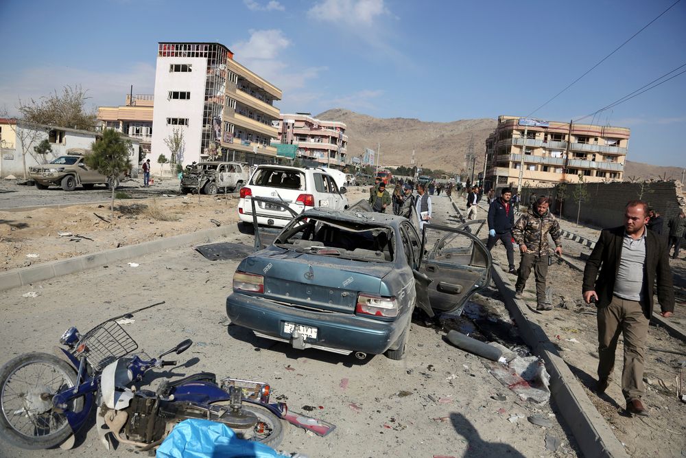 Afghan security personnel gather at the site of a car bomb attack in Kabul, Afghanistan, Wednesday, Nov. 13, 2019. A car bomb detonated in the Afghan capital of Kabul during Wednesday's morning commute, killing several people, officials said. (AP Photo/Rahmat Gul) Afghan security personnel gather at the site of a car bomb attack in Kabul, Afghanistan, Wednesday, Nov. 13, 2019. A car bomb detonated in the Afghan capital of Kabul during Wednesday's morning commute, killing several people, officials said. (AP Photo/Rahmat Gul)