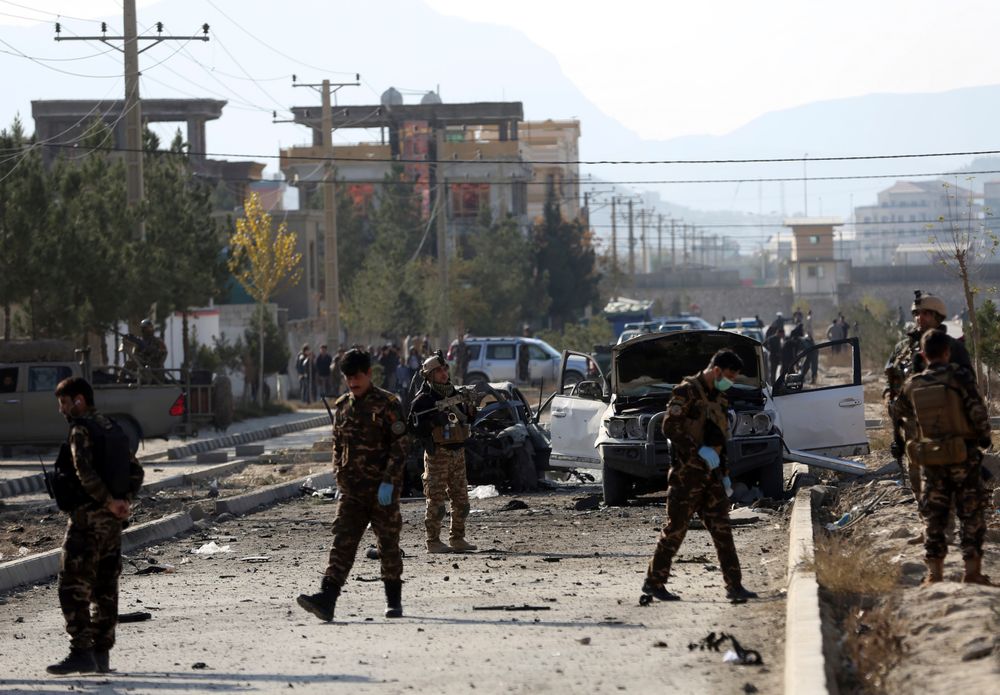 Afghan security personnel gather at the site of car bomb attack in Kabul, Afghanistan, Wednesday, Nov. 13, 2019. A car bomb detonated in the Afghan capital of Kabul during Wednesday's morning commute, killing several people, officials said. (AP Photo/Rahmat Gul) Afghan security personnel gather at the site of car bomb attack in Kabul, Afghanistan, Wednesday, Nov. 13, 2019. A car bomb detonated in the Afghan capital of Kabul during Wednesday's morning commute, killing several people, officials said. (AP Photo/Rahmat Gul)