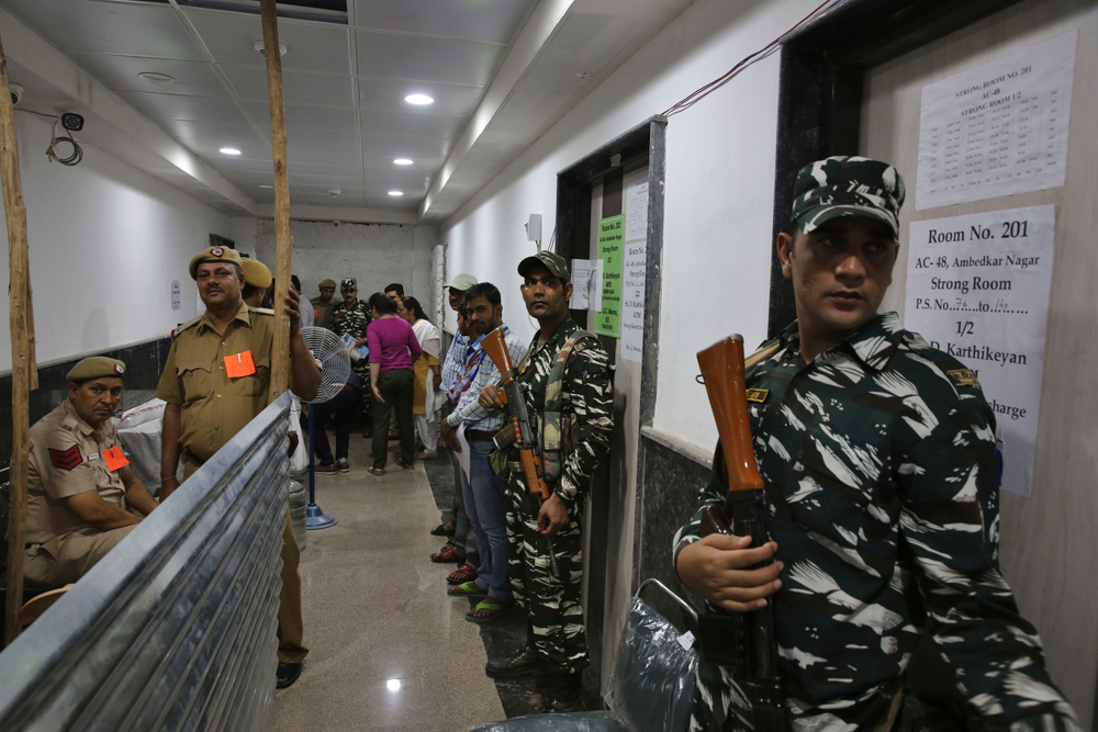 Indian paramilitary force soldiers stand guard outside a room where voting machines are stored as counting votes of India's massive general elections begins in New Delhi, India, Thursday, May 23, 2019. The count is expected to conclude by the evening, with strong trends visible by midday. (AP Photo/Manish Swarup) Indian paramilitary force soldiers stand guard outside a room where voting machines are stored as counting votes of India's massive general elections begins in New Delhi, India, Thursday, May 23, 2019. The count is expected to conclude by the evening, with strong trends visible by midday. (AP Photo/Manish Swarup)