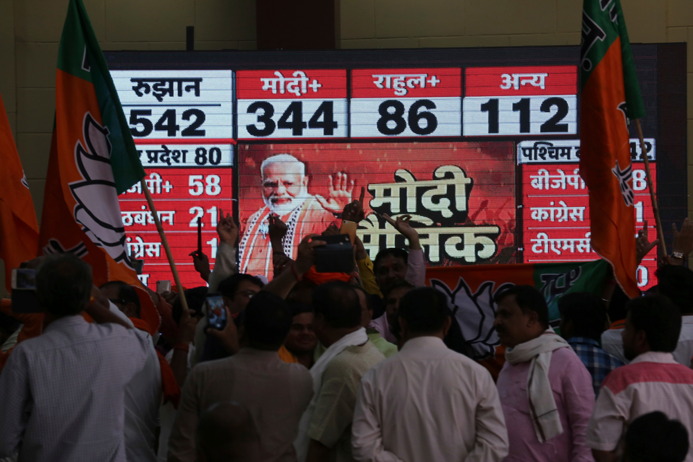 Bharatiya Janata Party (BJP) workers celebrate at BJP headquarters in, Lucknow, India, Thursday, May 23, 2019. Indian Prime Minister Narendra Modi and his party were off to an early lead as vote counting began Thursday following the conclusion of the country's 6-week-long general election, sending the stock market soaring in anticipation of another five-year term for the Hindu nationalist leader.(AP Photo/Rajesh Kumar Singh) Bharatiya Janata Party (BJP) workers celebrate at BJP headquarters in, Lucknow, India, Thursday, May 23, 2019. Indian Prime Minister Narendra Modi and his party were off to an early lead as vote counting began Thursday following the conclusion of the country's 6-week-long general election, sending the stock market soaring in anticipation of another five-year term for the Hindu nationalist leader.(AP Photo/Rajesh Kumar Singh)