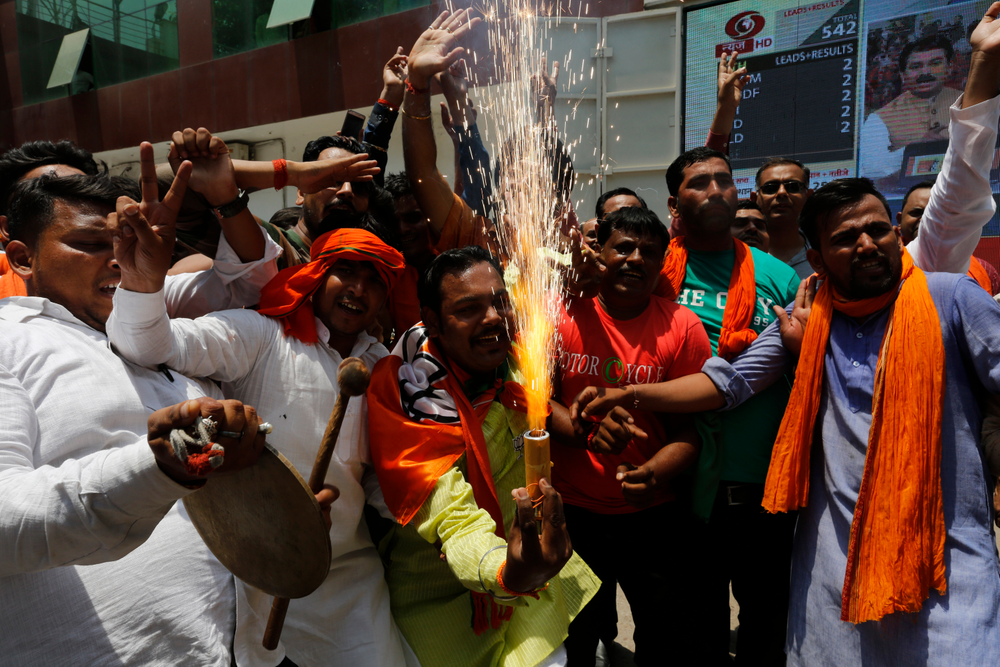 Bharatiya Janata Party (BJP) workers celebrate at BJP headquarters in, Lucknow, India, Thursday, May 23, 2019. Indian Prime Minister Narendra Modi and his party were off to an early lead as vote counting began Thursday following the conclusion of the country's 6-week-long general election, sending the stock market soaring in anticipation of another five-year term for the Hindu nationalist leader.(AP Photo/Rajesh Kumar Singh) Bharatiya Janata Party (BJP) workers celebrate at BJP headquarters in, Lucknow, India, Thursday, May 23, 2019. Indian Prime Minister Narendra Modi and his party were off to an early lead as vote counting began Thursday following the conclusion of the country's 6-week-long general election, sending the stock market soaring in anticipation of another five-year term for the Hindu nationalist leader.(AP Photo/Rajesh Kumar Singh)