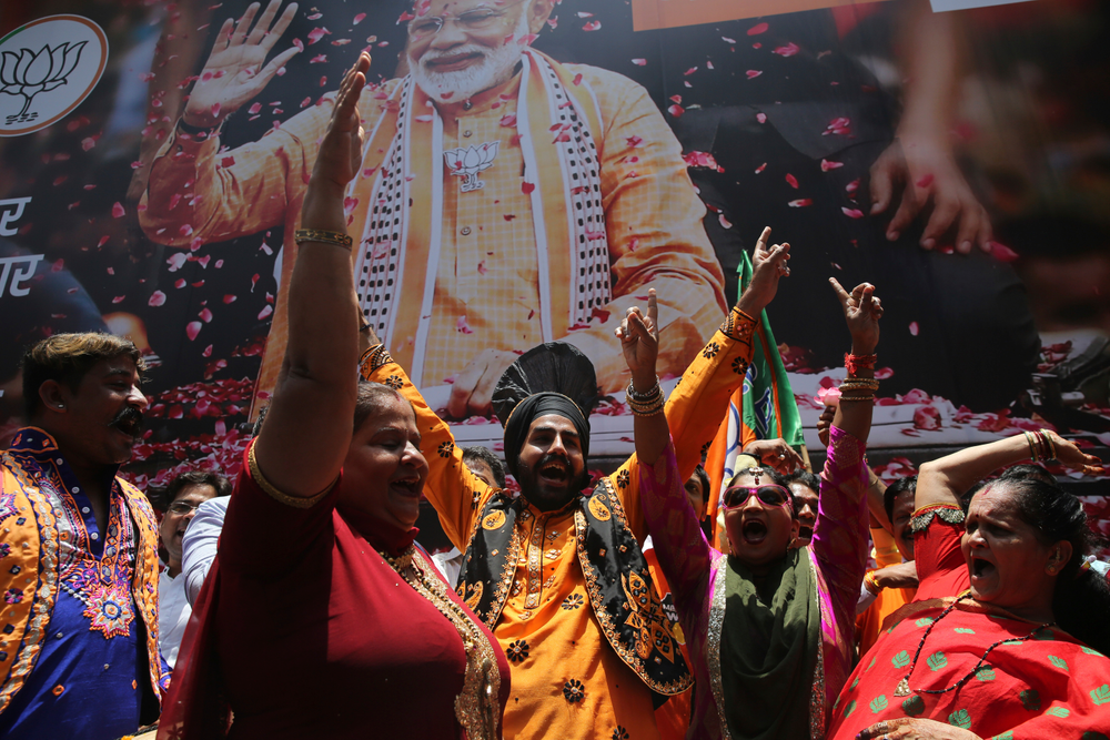 Bharatiya Janata Party (BJP) workers celebrate outside BJP headquarters in Mumbai, India, Thursday, May 23, 2019. Indian Prime Minister Narendra Modi and his party were off to an early lead as vote counting began Thursday following the conclusion of the country's 6-week-long general election, sending the stock market soaring in anticipation of another five-year term for the Hindu nationalist leader. (AP Photo/Rafiq Maqbool) Bharatiya Janata Party (BJP) workers celebrate outside BJP headquarters in Mumbai, India, Thursday, May 23, 2019. Indian Prime Minister Narendra Modi and his party were off to an early lead as vote counting began Thursday following the conclusion of the country's 6-week-long general election, sending the stock market soaring in anticipation of another five-year term for the Hindu nationalist leader. (AP Photo/Rafiq Maqbool)
