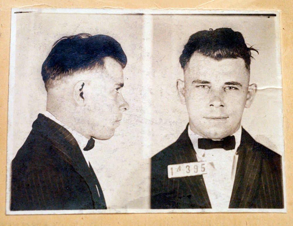 FILE - This undated file photo shows Indiana Reformatory booking shots of John Dillinger, stored in the state archives. A judge will hear an Indianapolis cemetery's bid Wednesday, Nov. 4, 2019, to dismiss a lawsuit filed by a relative of the 1930s gangster who wants to exhume Dillinger’s gravesite to determine if the notorious criminal is actually buried there. (Indiana State Archives/The Indianapolis Star via AP, File) FILE - This undated file photo shows Indiana Reformatory booking shots of John Dillinger, stored in the state archives. A judge will hear an Indianapolis cemetery's bid Wednesday, Nov. 4, 2019, to dismiss a lawsuit filed by a relative of the 1930s gangster who wants to exhume Dillinger’s gravesite to determine if the notorious criminal is actually buried there. (Indiana State Archives/The Indianapolis Star via AP, File)