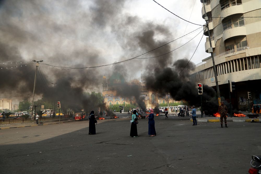 Fires set by protesters close roads during ongoing anti-government protests in Baghdad, Iraq, Sunday, Nov. 3, 2019. Iraqi protesters have begun blocking roads in Baghdad to raise pressure on the government to resign. (AP Photo/Hadi Mizban) Fires set by protesters close roads during ongoing anti-government protests in Baghdad, Iraq, Sunday, Nov. 3, 2019. Iraqi protesters have begun blocking roads in Baghdad to raise pressure on the government to resign. (AP Photo/Hadi Mizban)