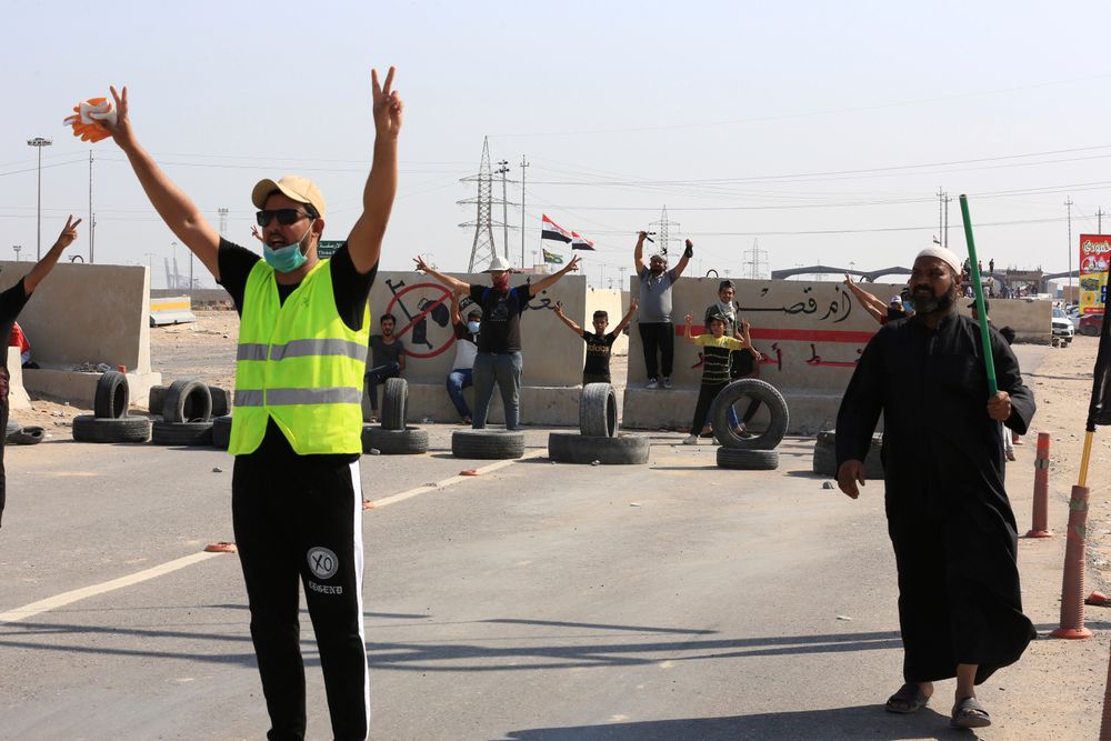 Anti-government protesters block the port of Umm Qasr a day after clashes between security forces and protesters, in Basra, Iraq, Sunday, Nov. 3, 2019. (AP Photo/Nabil al-Jourani) Anti-government protesters block the port of Umm Qasr a day after clashes between security forces and protesters, in Basra, Iraq, Sunday, Nov. 3, 2019. (AP Photo/Nabil al-Jourani)