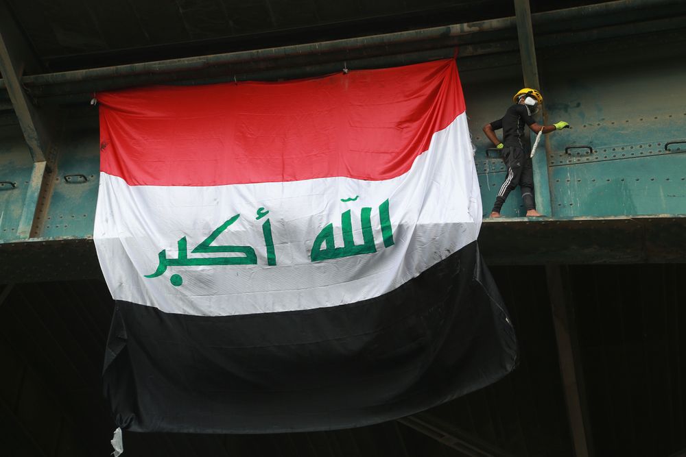 An anti-government protester climbs the Joumhouriya Bridge that leads to the Green Zone government area, during ongoing protests in Baghdad, Iraq, Sunday, Nov. 3, 2019. (AP Photo/Hadi Mizban) An anti-government protester climbs the Joumhouriya Bridge that leads to the Green Zone government area, during ongoing protests in Baghdad, Iraq, Sunday, Nov. 3, 2019. (AP Photo/Hadi Mizban)
