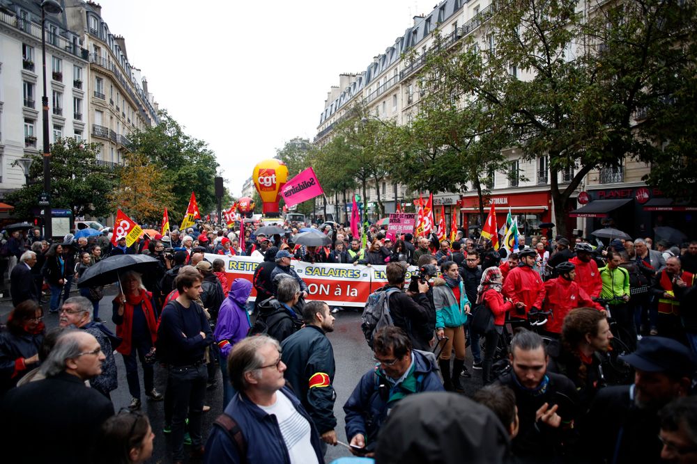 People attend a march over the pension reform, in Paris, Tuesday, Sept. 24, 2019. Unions marches in Paris and other cities over the pension reform, which they fear will require people to work longer and reduce pensions. France's current retirement age is 62. (AP Photo/Thibault Camus) People attend a march over the pension reform, in Paris, Tuesday, Sept. 24, 2019. Unions marches in Paris and other cities over the pension reform, which they fear will require people to work longer and reduce pensions. France's current retirement age is 62. (AP Photo/Thibault Camus)
