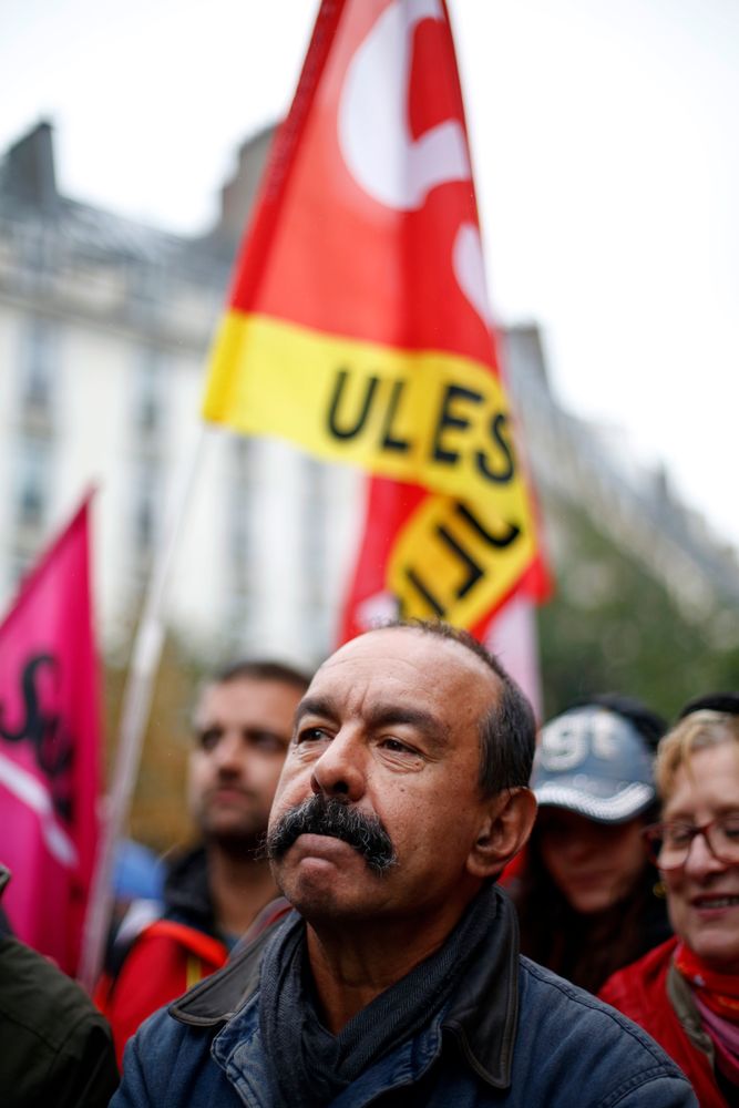 CGT labor union leader Philippe Martinez attends a march over the pension reform, in Paris, Tuesday, Sept. 24, 2019. Unions marches in Paris and other cities over the pension reform, which they fear will require people to work longer and reduce pensions. France's current retirement age is 62. (AP Photo/Thibault Camus) CGT labor union leader Philippe Martinez attends a march over the pension reform, in Paris, Tuesday, Sept. 24, 2019. Unions marches in Paris and other cities over the pension reform, which they fear will require people to work longer and reduce pensions. France's current retirement age is 62. (AP Photo/Thibault Camus)