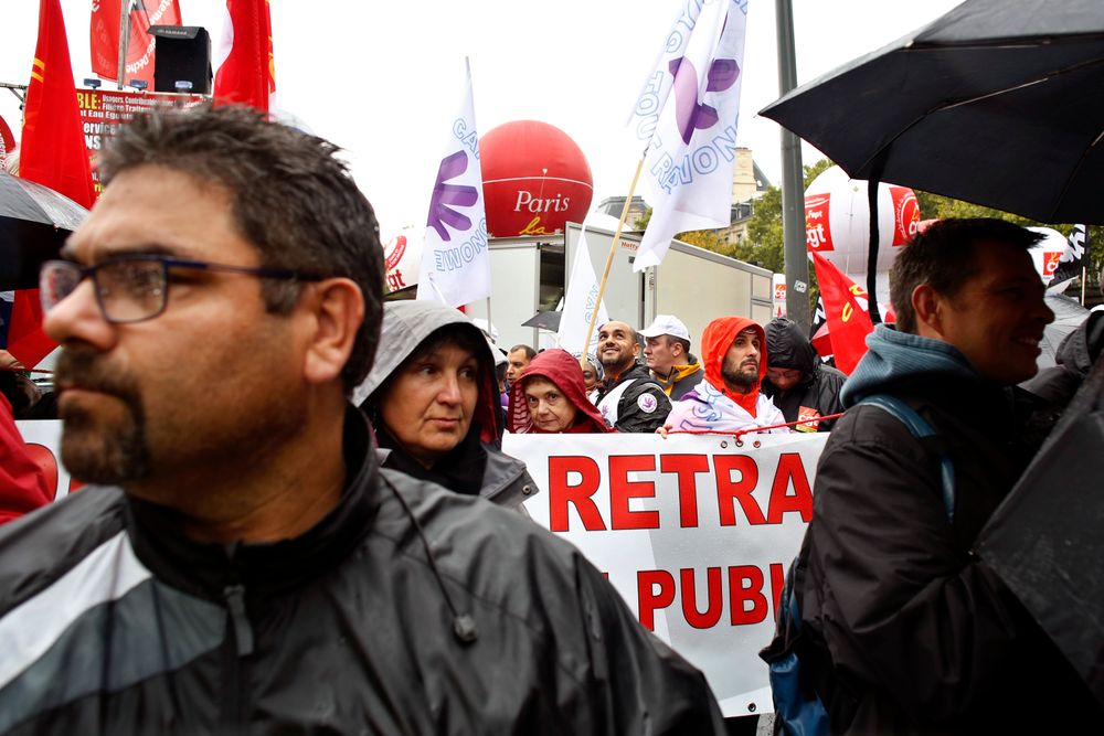 People attend a march over the pension reform, in Paris, Tuesday, Sept. 24, 2019. Unions marches in Paris and other cities over the pension reform, which they fear will require people to work longer and reduce pensions. France's current retirement age is 62. (AP Photo/Thibault Camus) People attend a march over the pension reform, in Paris, Tuesday, Sept. 24, 2019. Unions marches in Paris and other cities over the pension reform, which they fear will require people to work longer and reduce pensions. France's current retirement age is 62. (AP Photo/Thibault Camus)