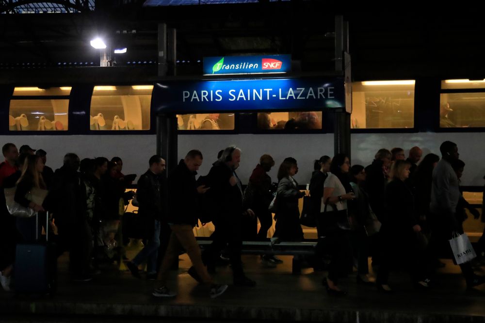 Commuters arrive at Gare Saint Lazare train station in Paris, Tuesday, Sept. 24, 2019. A French rail strike is disrupting train travel and unions plan marches in Paris and other cities over President Emmanuel Macron's proposed overhaul of the retirement system. Workers for the SNCF national railway fear the reform will require people to work longer and reduce pensions. (AP Photo/Michel Euler) Commuters arrive at Gare Saint Lazare train station in Paris, Tuesday, Sept. 24, 2019. A French rail strike is disrupting train travel and unions plan marches in Paris and other cities over President Emmanuel Macron's proposed overhaul of the retirement system. Workers for the SNCF national railway fear the reform will require people to work longer and reduce pensions. (AP Photo/Michel Euler)
