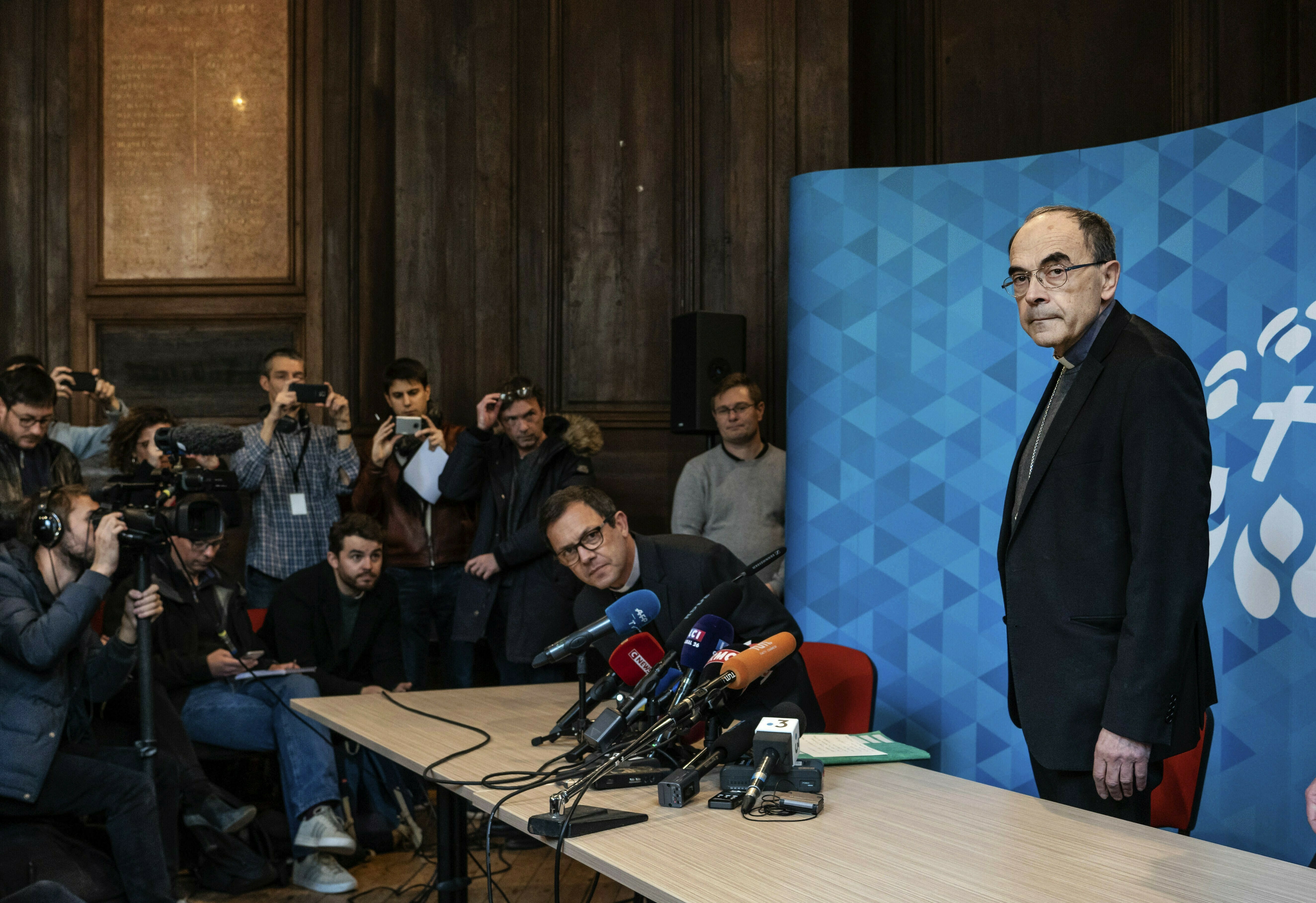 French Cardinal Philippe Barbarin, right, arrives for a press conference in Lyon, central France, Thursday, March 7, 2019. Barbarin offers his resignation to the Pope after a court on Thursday found him guilty of failing to report to authorities allegations of sexual abuse of minors by a priest. (AP Photo/Laurent Cipriani) French Cardinal Philippe Barbarin, right, arrives for a press conference in Lyon, central France, Thursday, March 7, 2019. Barbarin offers his resignation to the Pope after a court on Thursday found him guilty of failing to report to authorities allegations of sexual abuse of minors by a priest. (AP Photo/Laurent Cipriani)