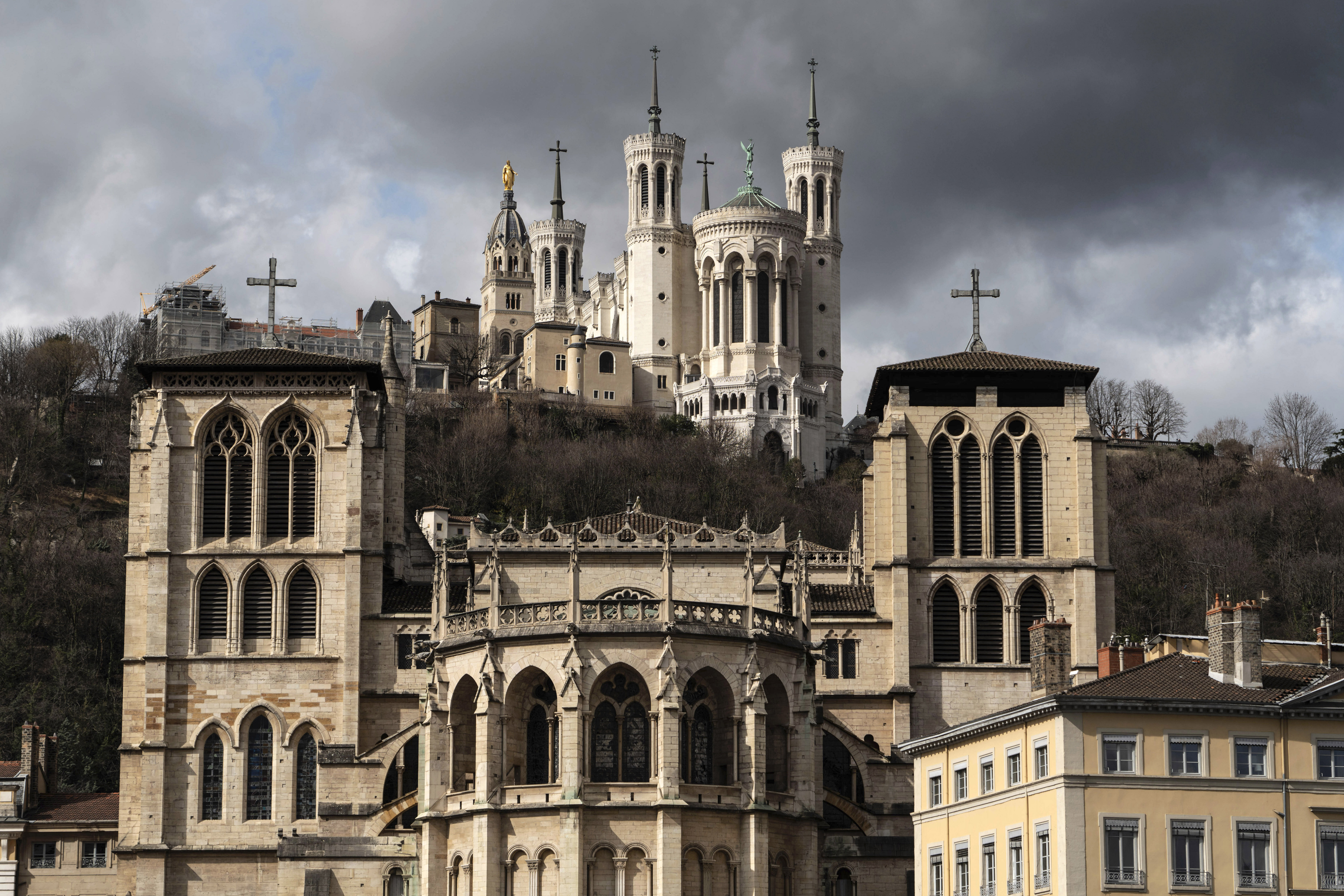 The Saint-Jean Cathedral, foreground, and the Fourviere Basilica, top, are pictured in Lyon, central France, Thursday, March 7, 2019. France's top catholic official Cardinal Philippe Barbarin said he will offer his resignation to Pope Francis, after a court found him guilty of failing to report allegations of sexual abuse of minors by a priest. (AP Photo/Laurent Cipriani) The Saint-Jean Cathedral, foreground, and the Fourviere Basilica, top, are pictured in Lyon, central France, Thursday, March 7, 2019. France's top catholic official Cardinal Philippe Barbarin said he will offer his resignation to Pope Francis, after a court found him guilty of failing to report allegations of sexual abuse of minors by a priest. (AP Photo/Laurent Cipriani)